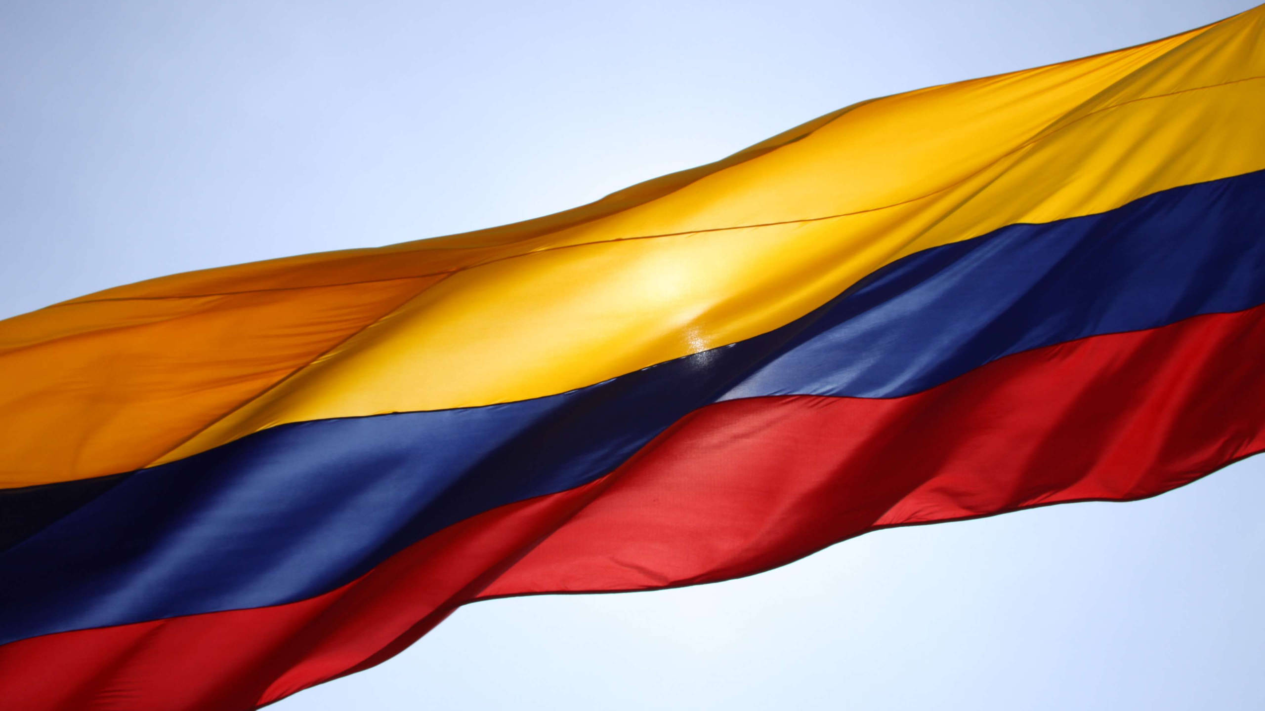 Colombia flag, pale blue sky, vivid yellow, 2K Desktop Wallpaper
