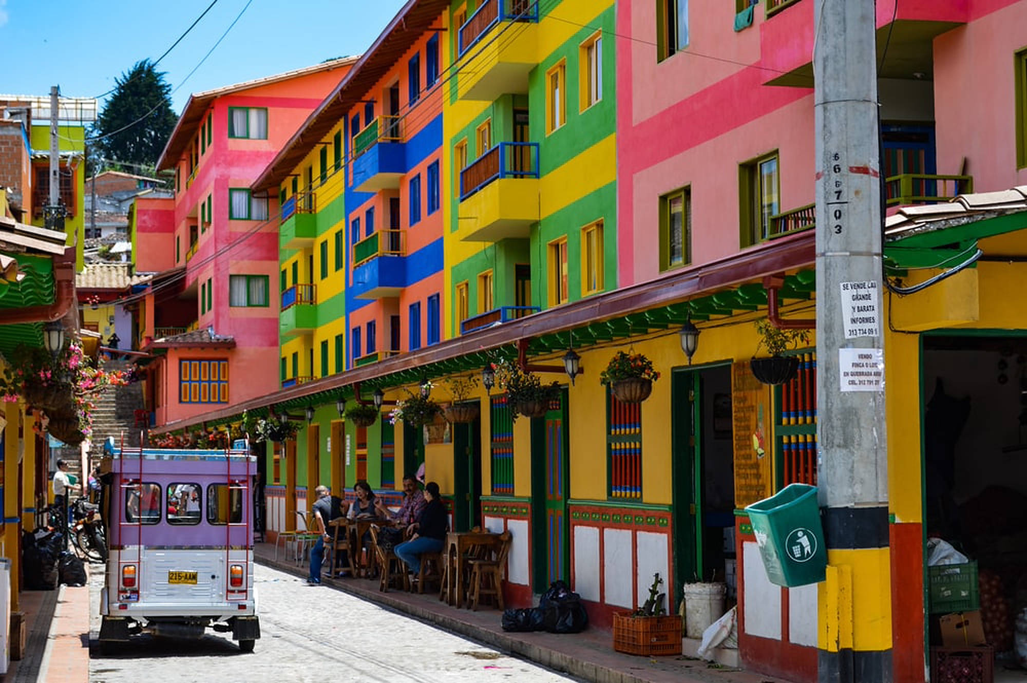 Colombia, rainbow-colored buildings, bustling cobblestone street, Full HD Desktop Wallpaper