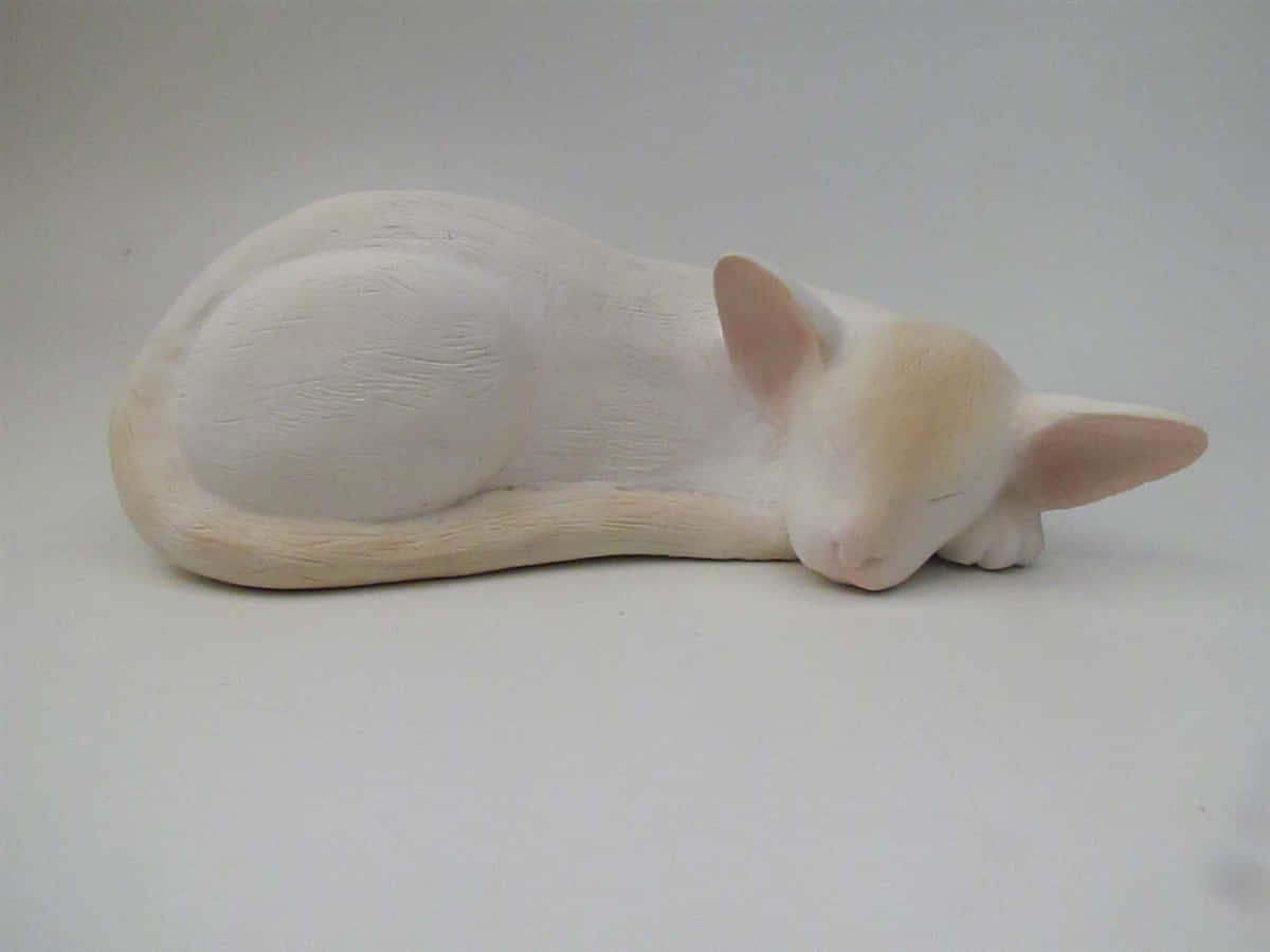 Colorpoint Shorthair, white ceramic cat figurine, plain white surface, SD Desktop Wallpaper