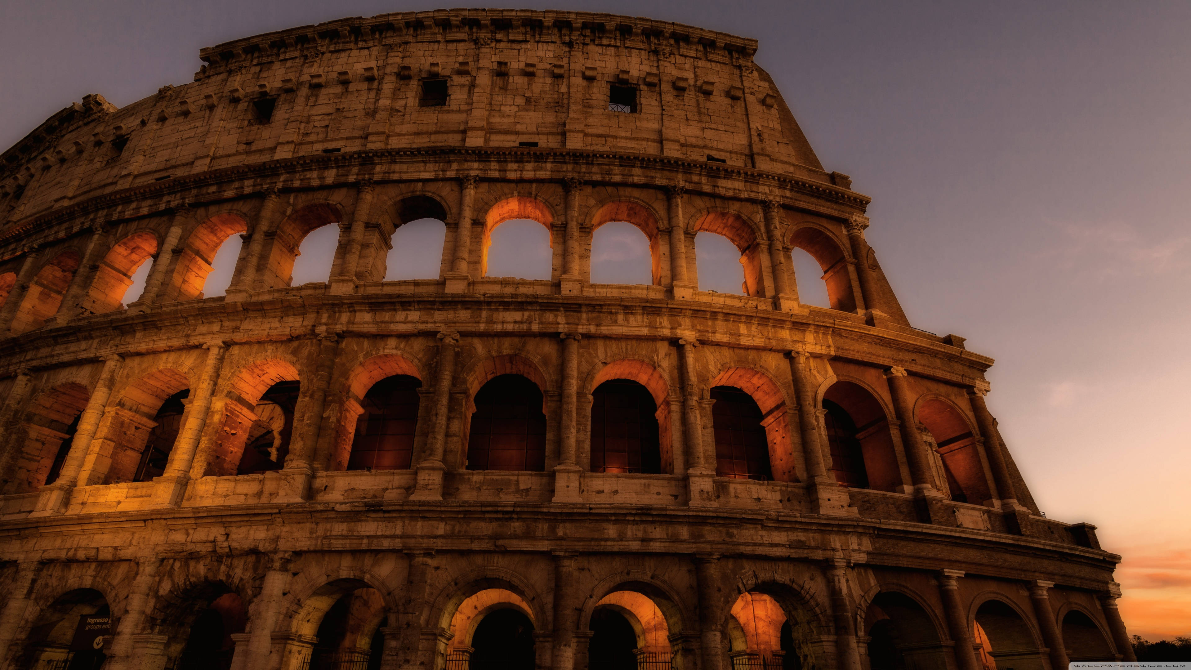 Colosseum, golden sunset light, warm tones, 4K Desktop Wallpaper