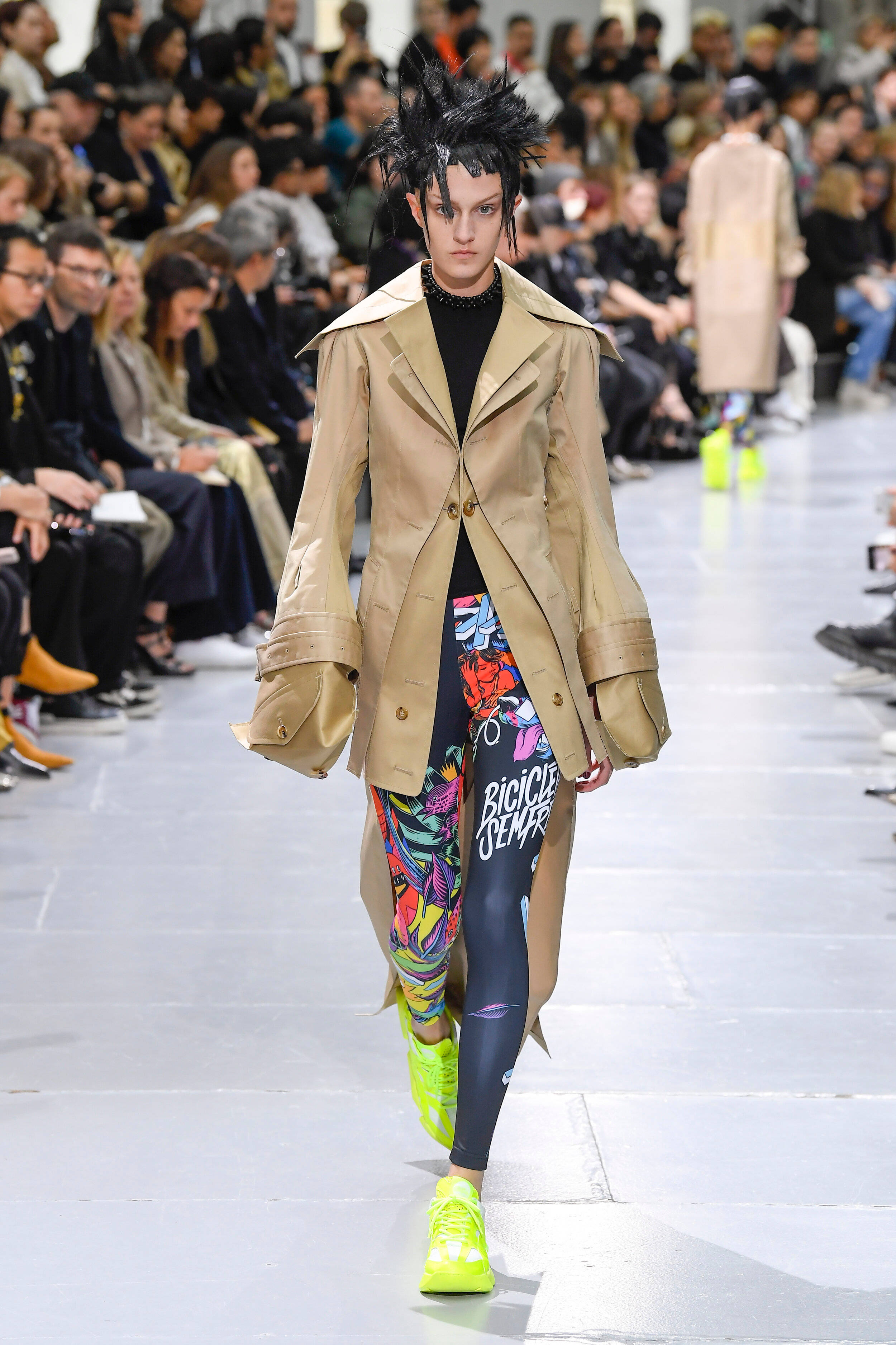 Comme Des Garçons, beige trench coat, vibrant graffiti-print leggings, 2K Phone Wallpaper
