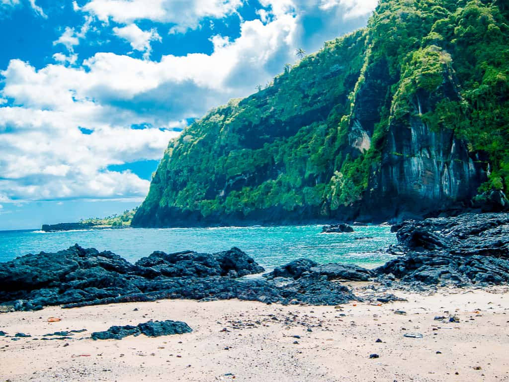Comoros, black lava rocks, turquoise water, SD Desktop Wallpaper