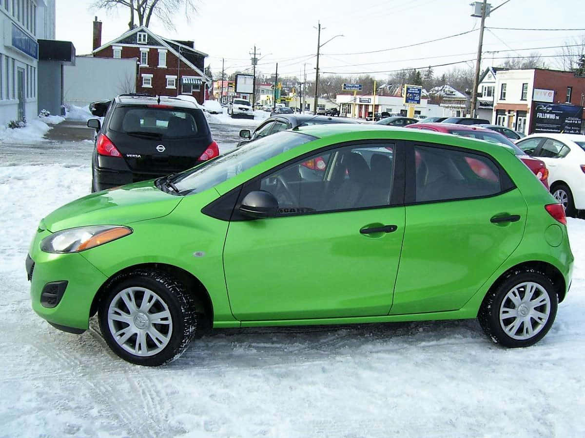 compact car, bright green, snowy ground, SD Desktop Wallpaper