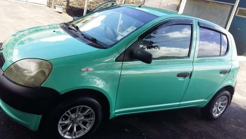 teal, compact car, outdoors, SD Desktop Wallpaper