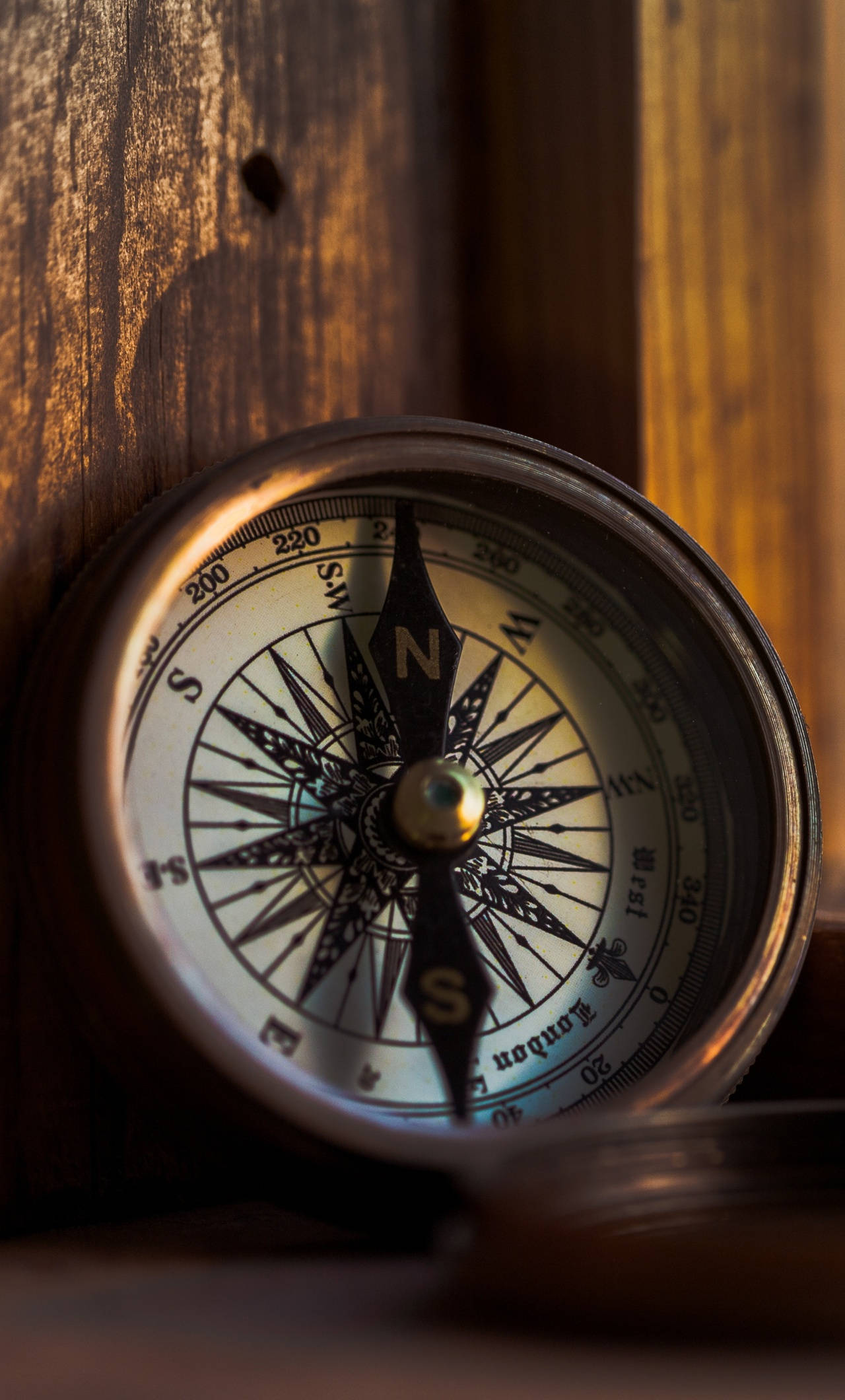 vintage brass compass, ornate needle, wooden surface, Full HD Phone Wallpaper