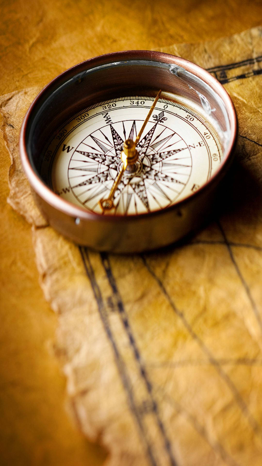 vintage brass compass, weathered parchment map, faded grid lines, Full HD Phone Wallpaper
