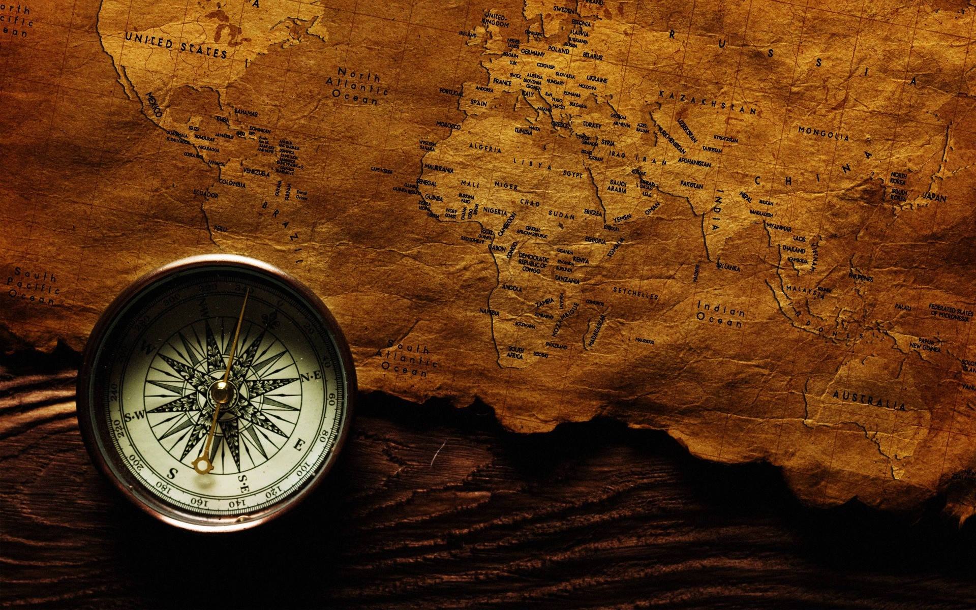 vintage brass compass, weathered world map, dark wooden surface, Full HD Desktop Wallpaper