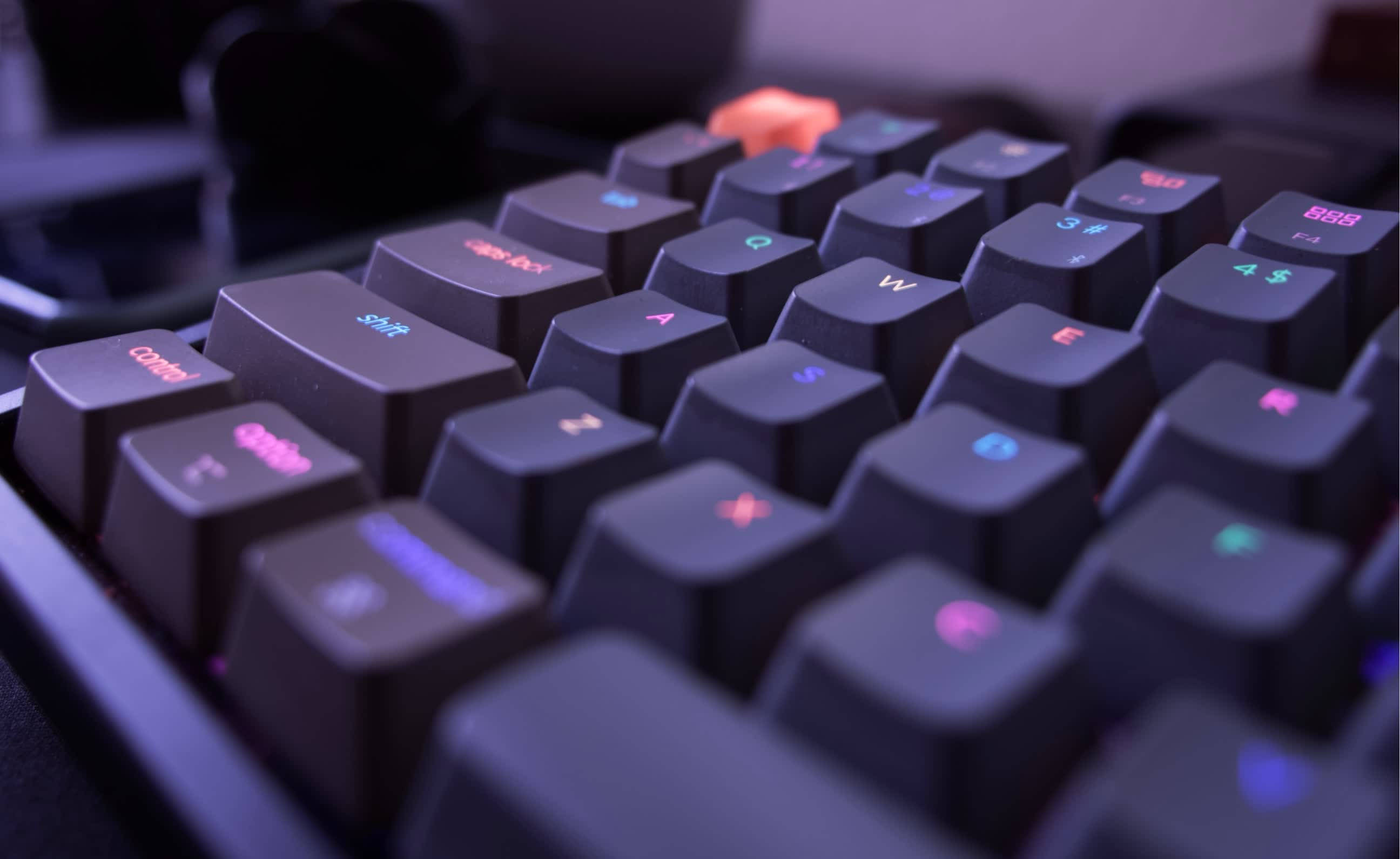 neon color mechanical computer keyboard, mechanical keyboard, glowing multicolored backlighting, 2K Desktop Wallpaper