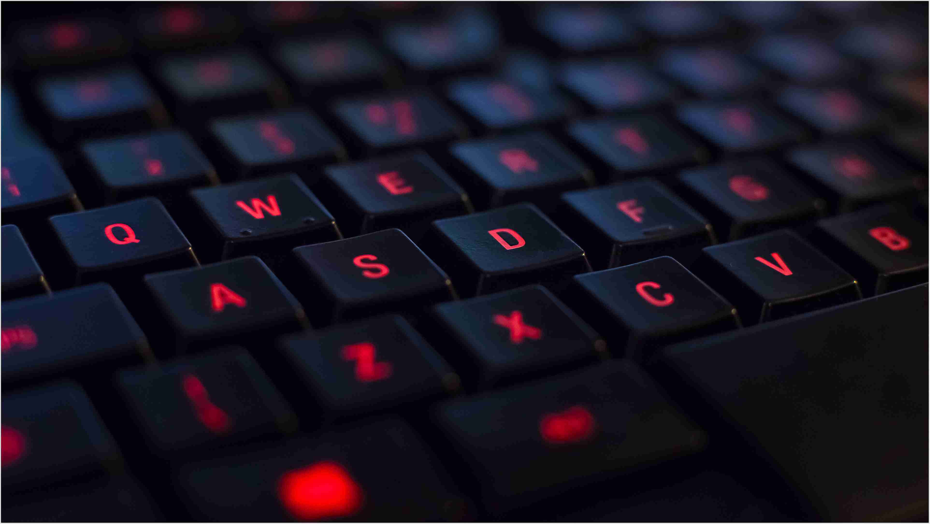 Fiery Red Light Computer Keyboard, dark keyboard, glowing red backlighting, 4K Desktop Wallpaper