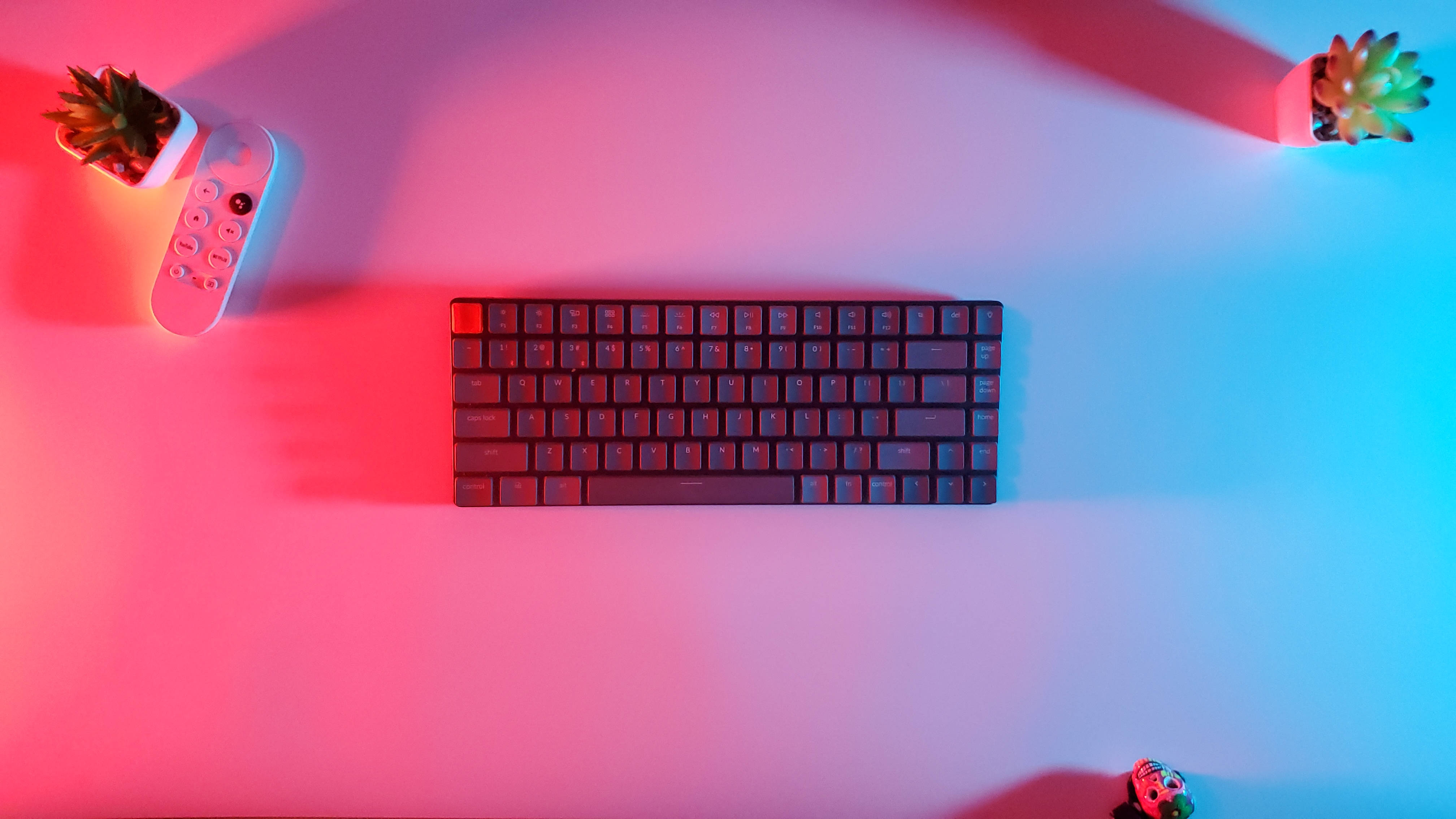sleek black keyboard, white desk, vibrant pink and blue neon light, 4K Desktop Wallpaper