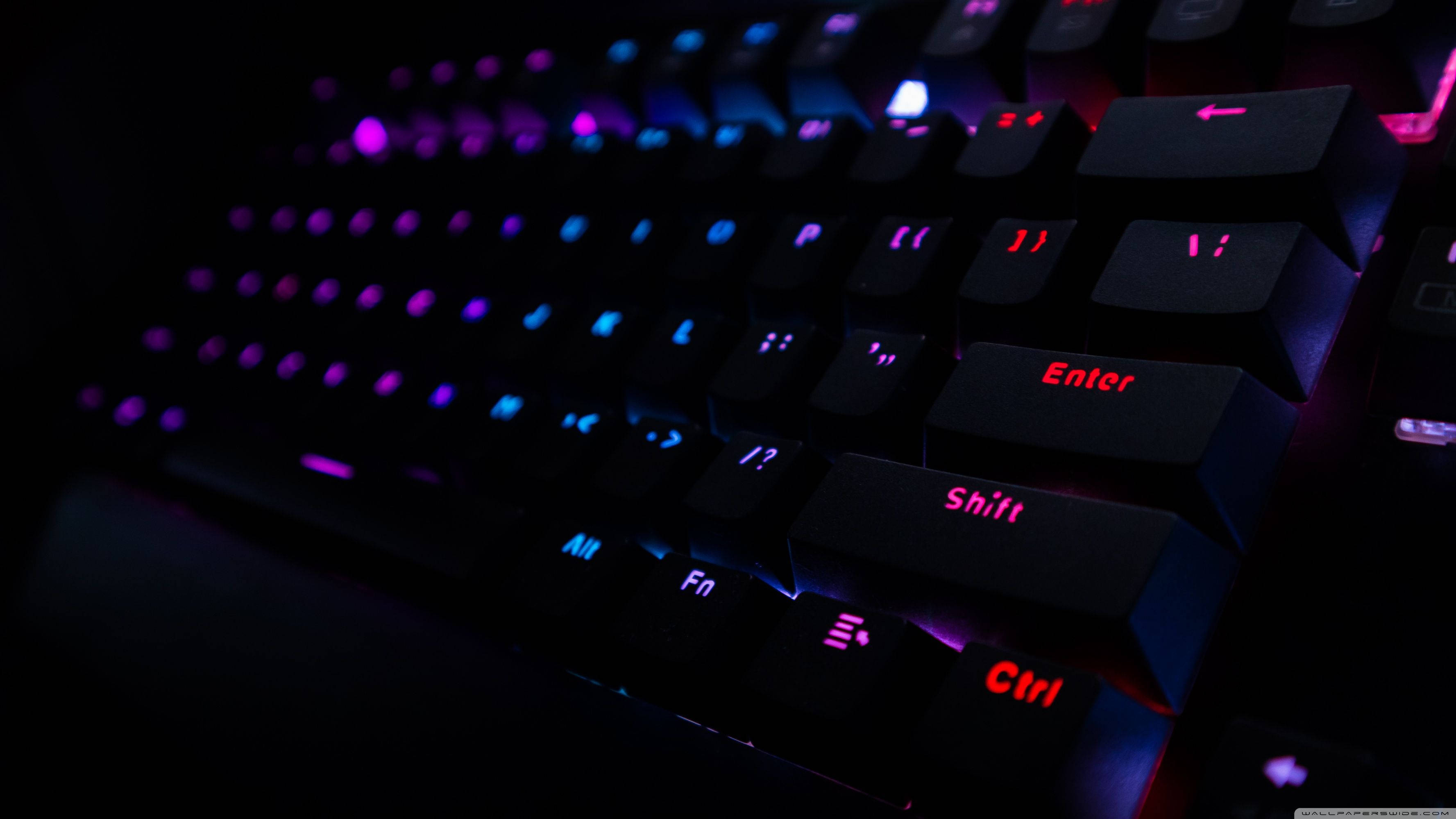 Dark Keyboard RGB 4K, black gaming keyboard, vibrant purple and blue backlighting, 2K Desktop Wallpaper