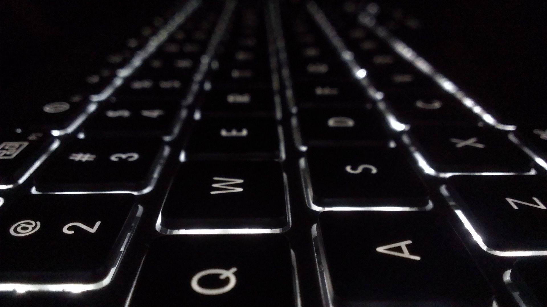 black keyboard, glowing white lettering, dramatic low-angle lighting, Full HD Desktop Wallpaper