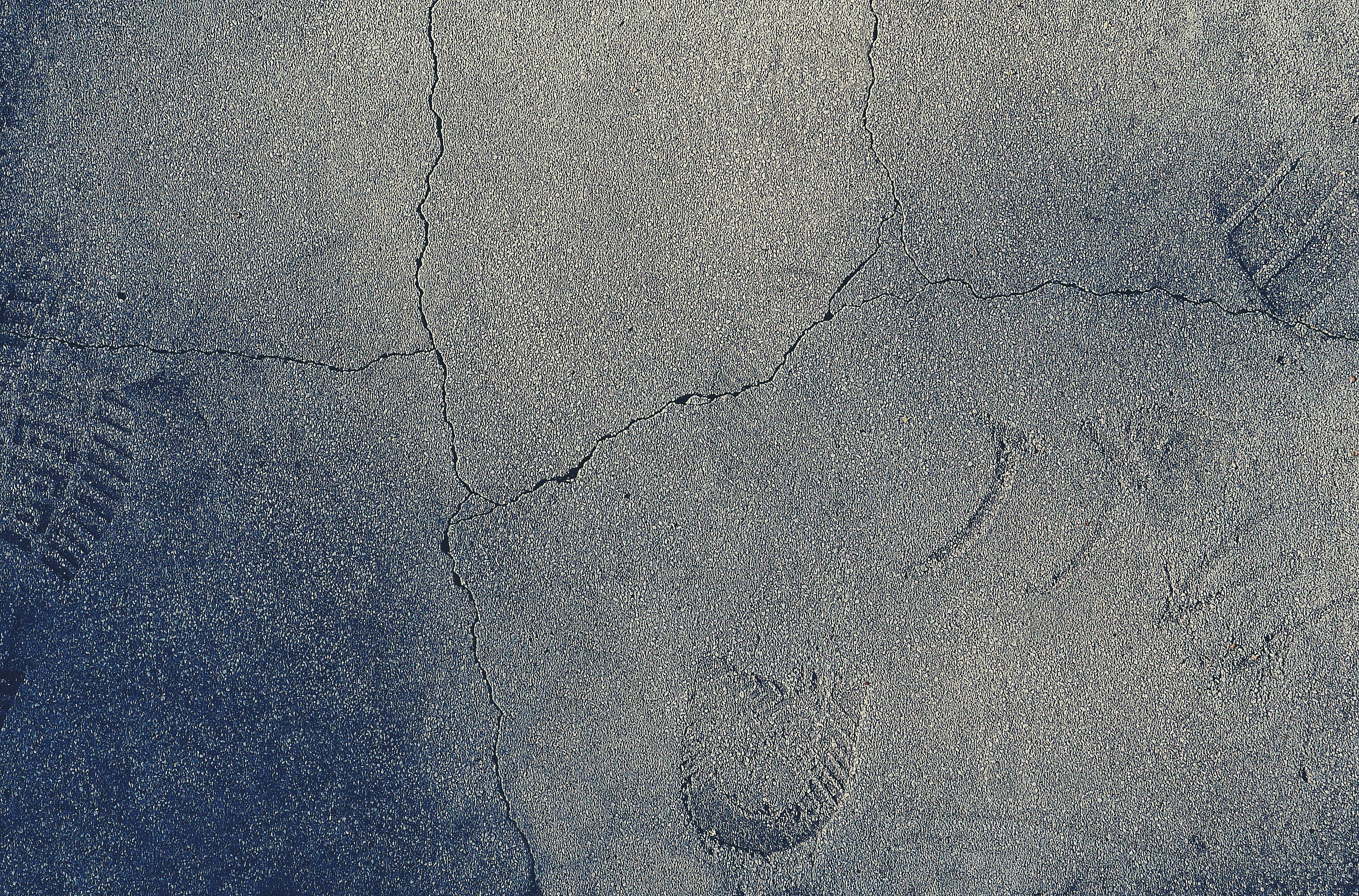 concrete texture, cracked gray pavement, faded graffiti, 2K Desktop Wallpaper