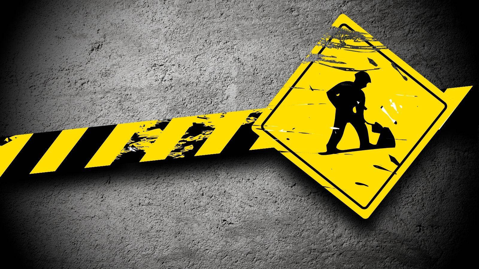 yellow construction warning sign, worker silhouette, gritty gray concrete wall, HD Desktop Wallpaper