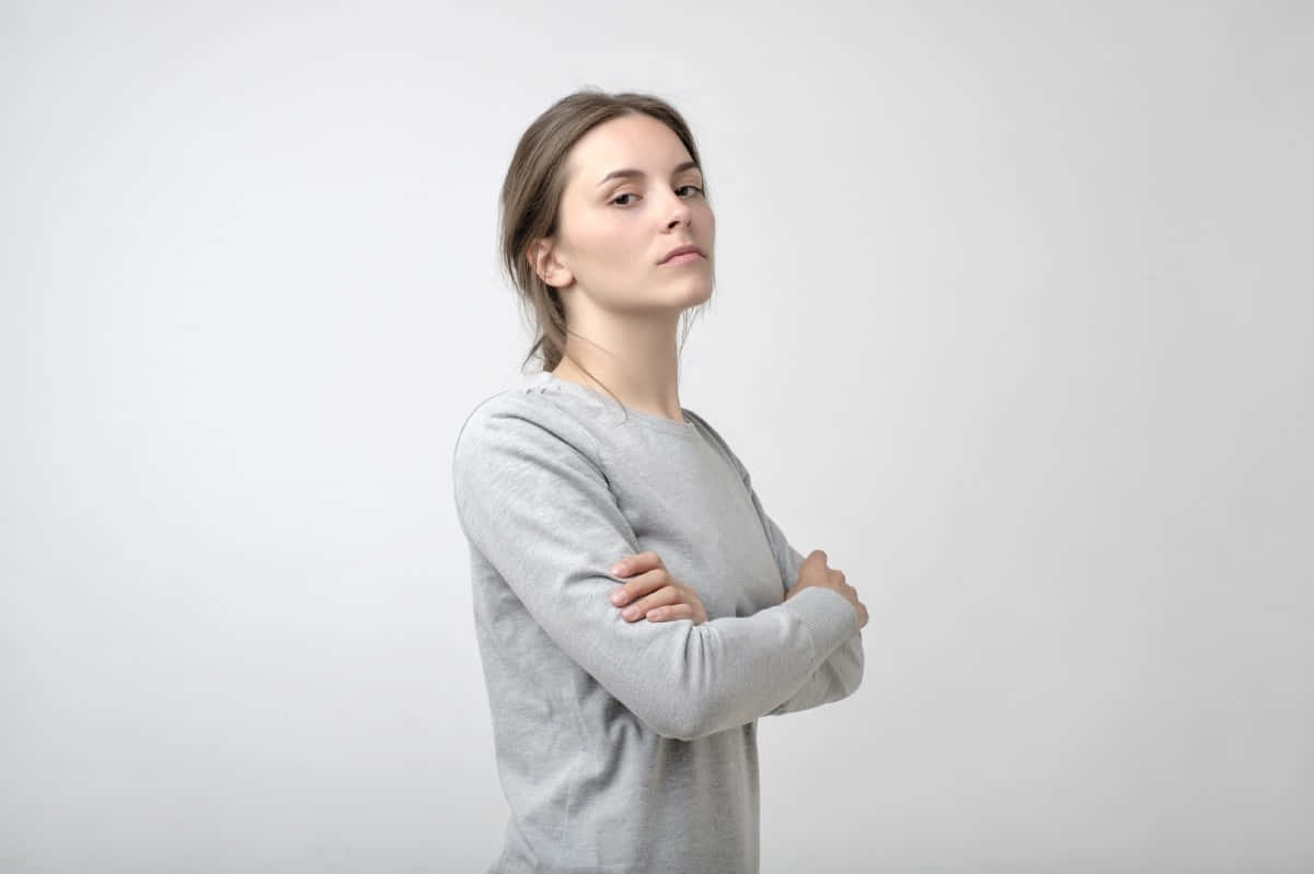 egotistical confidence, gray sweater, arms crossed, SD Desktop Wallpaper