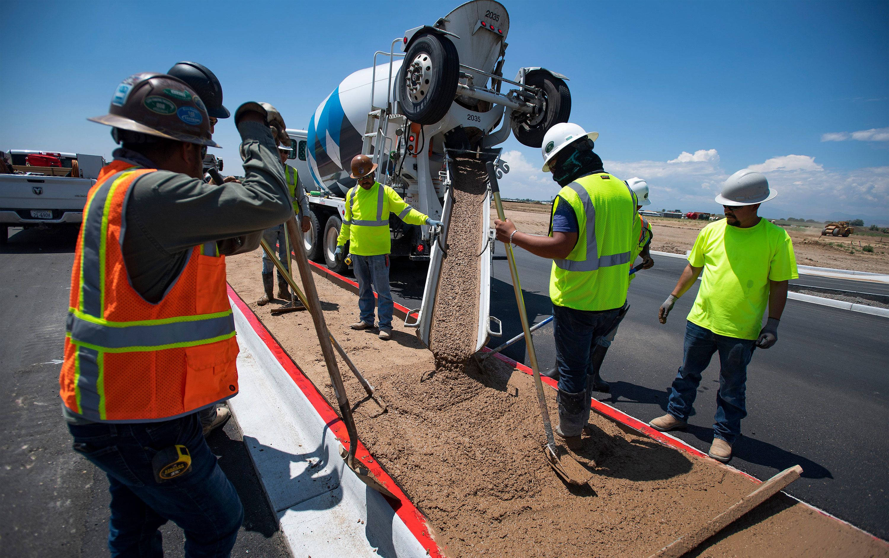 construction workers, bright safety gear, fresh concrete, 2K Desktop Wallpaper