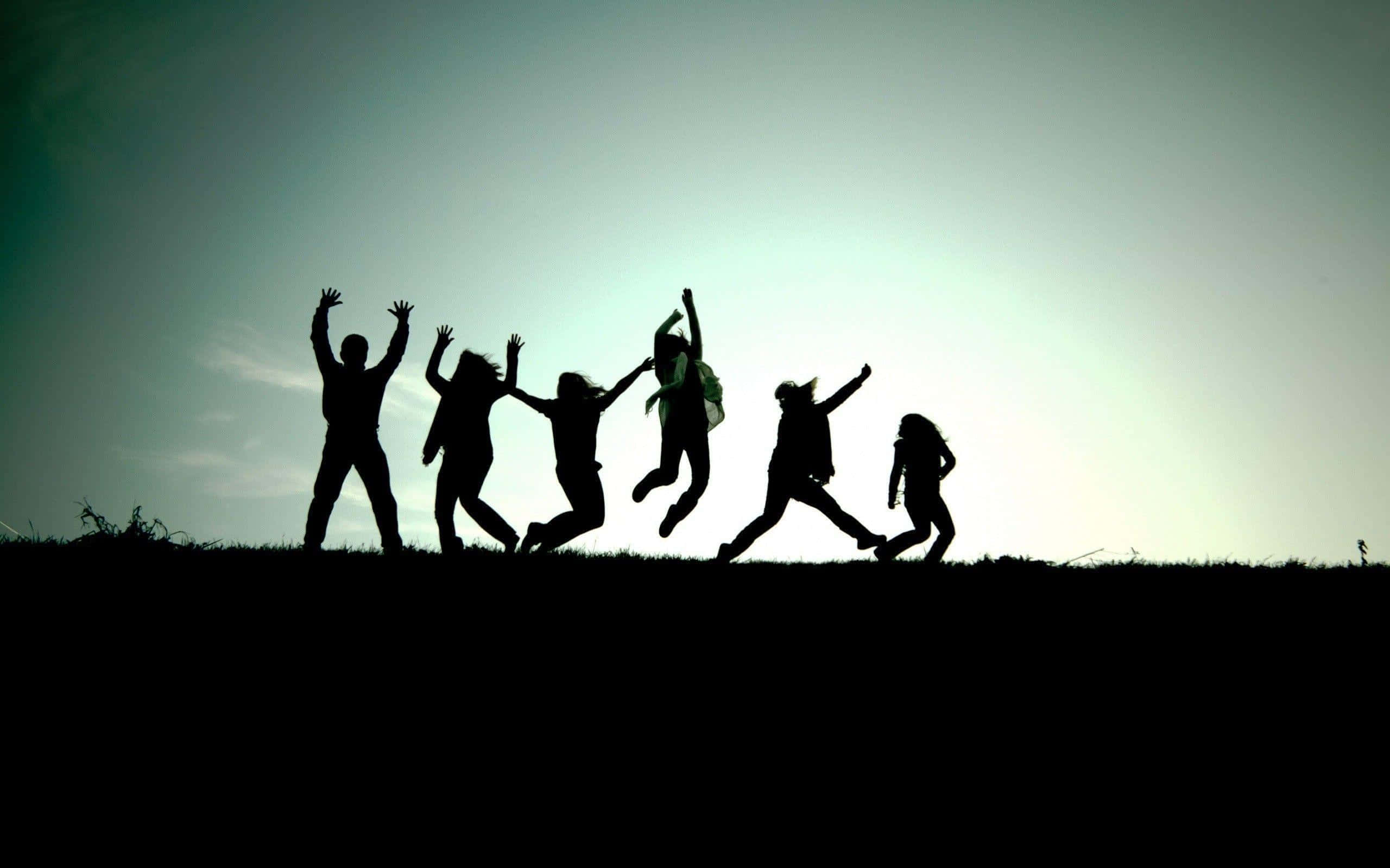 Serene Sunset by the Lake, six joyful people, jumping in unison, 2K Desktop Wallpaper