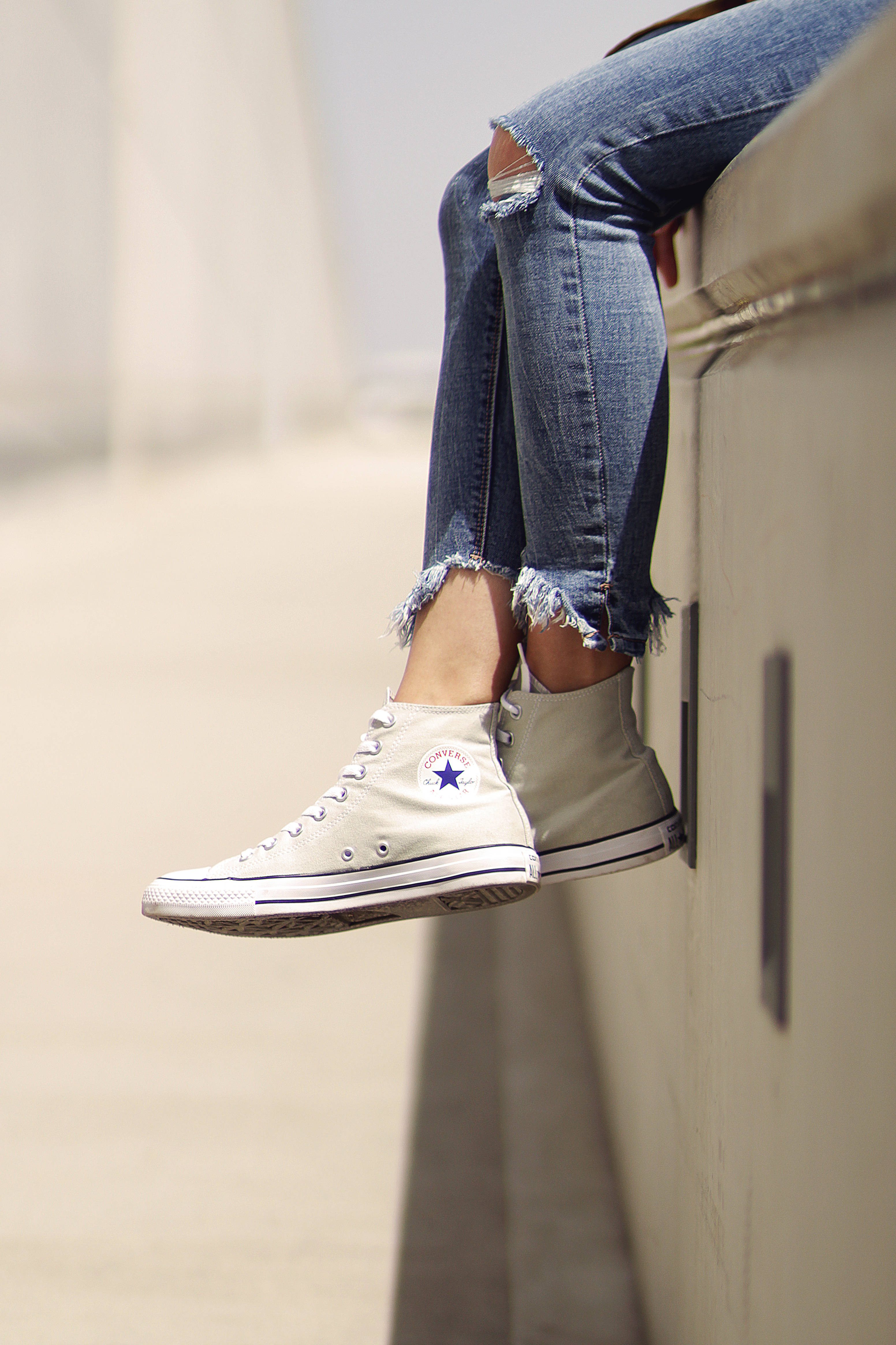 high cut white converse sneakers, ripped jeans, concrete ledge, 4K Phone Wallpaper