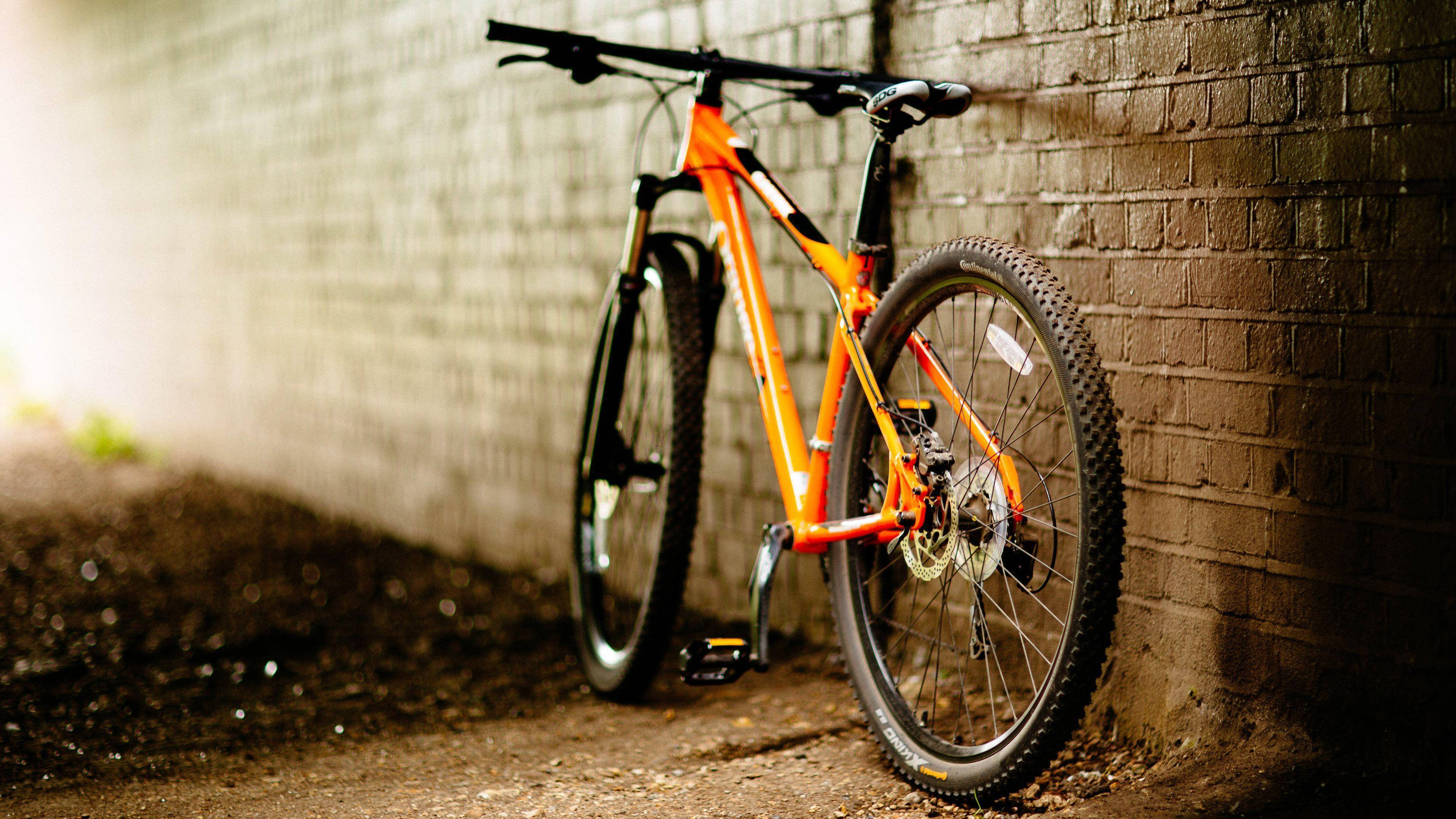 orange, mountain bike, weathered brick wall, 4K Desktop Wallpaper