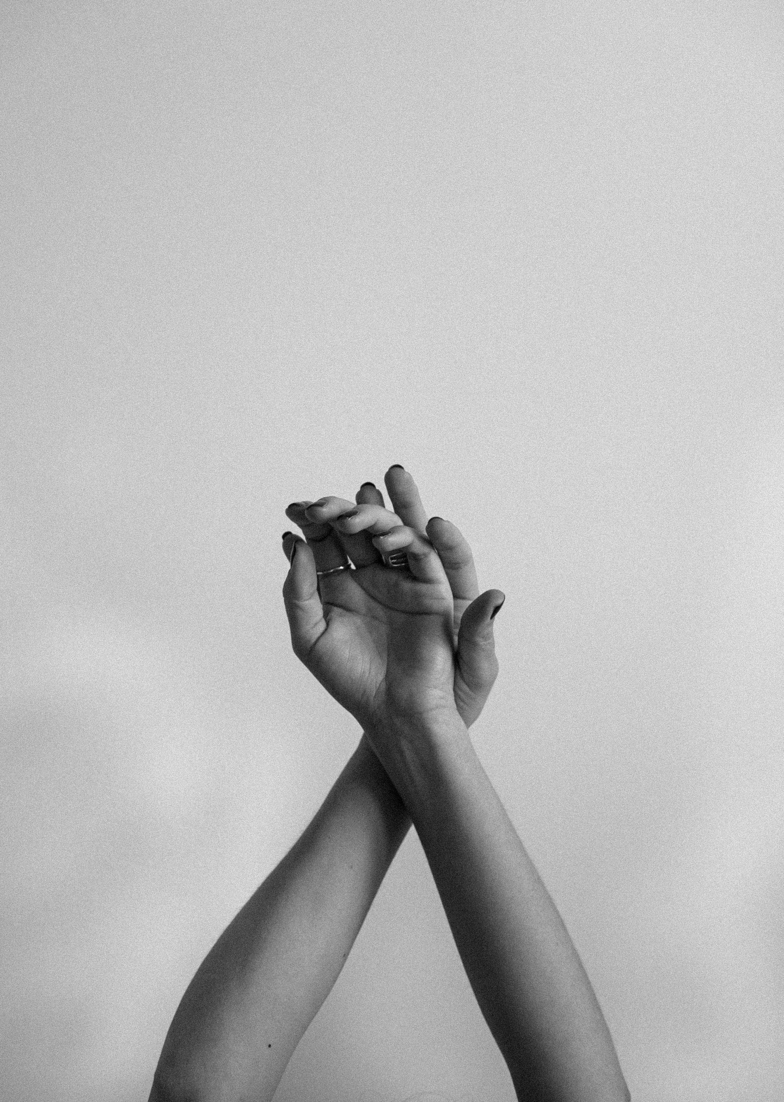 black and white photo, plain background, hands clasped together, 2K Phone Wallpaper