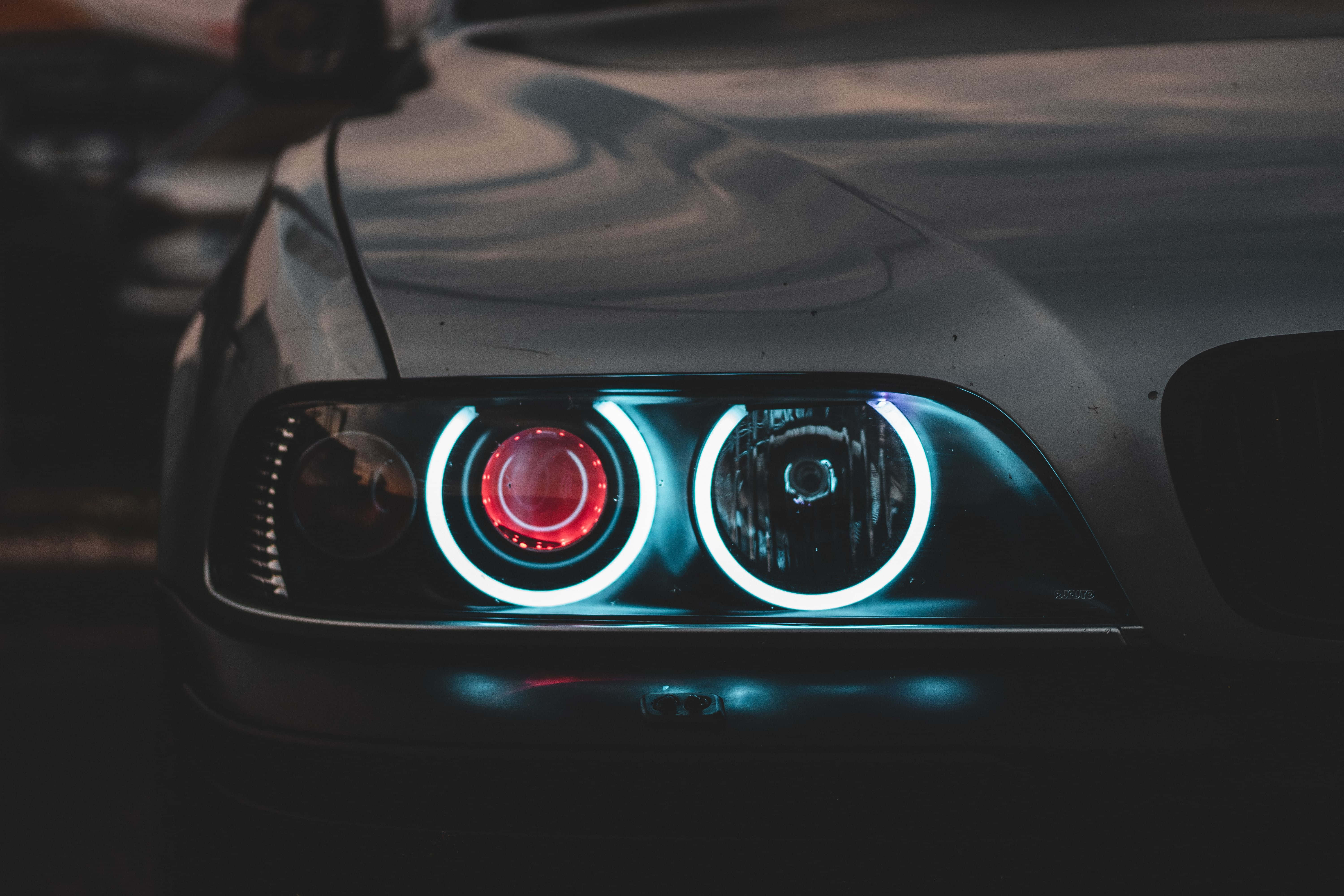 Cool BMW, glowing headlights, red and blue rings, 5K Desktop Wallpaper