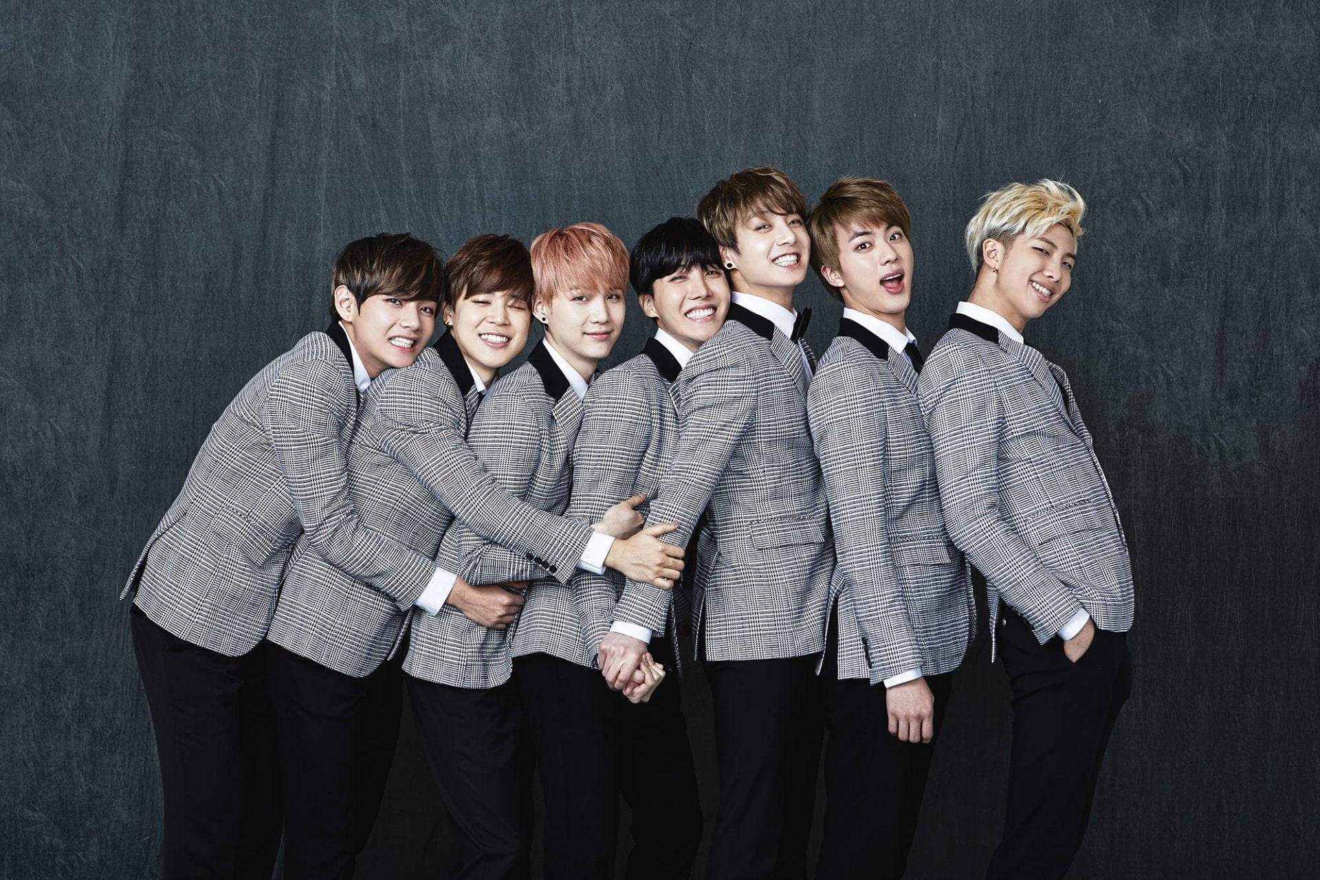 gray plaid suits, Seven smiling young men, dark textured backdrop, Full HD Desktop Wallpaper