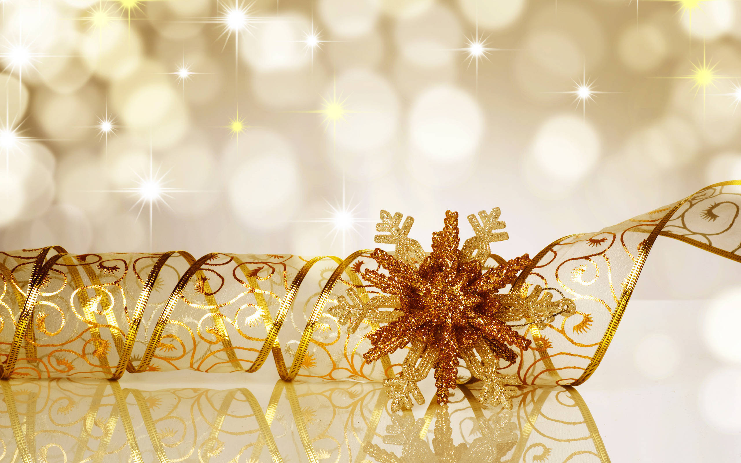 gold snowflake ornament, ornate ribbon, sparkling bokeh background, 2K Desktop Wallpaper