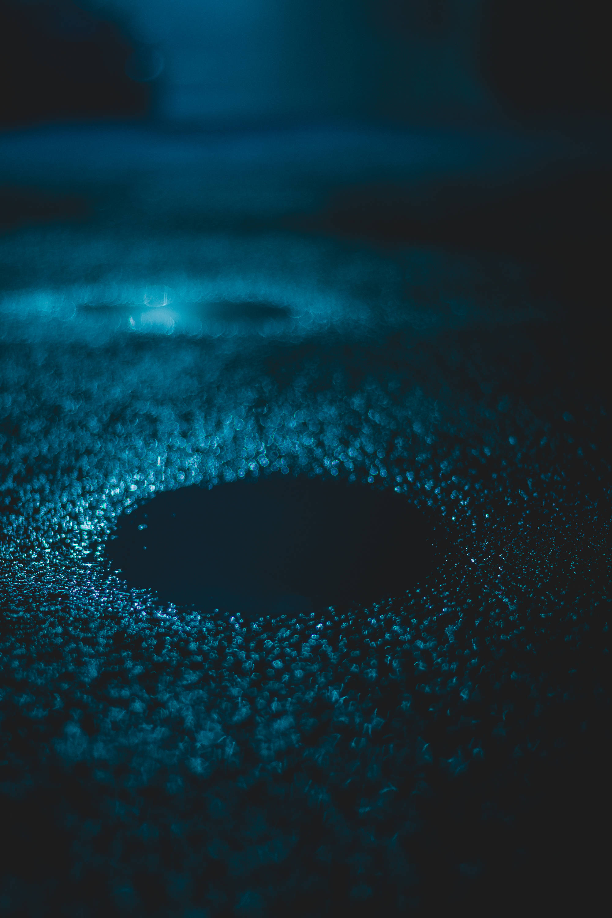 Cool Blue Rainwater Puddle, dark blue puddle, glistening water droplets, 2K Phone Wallpaper