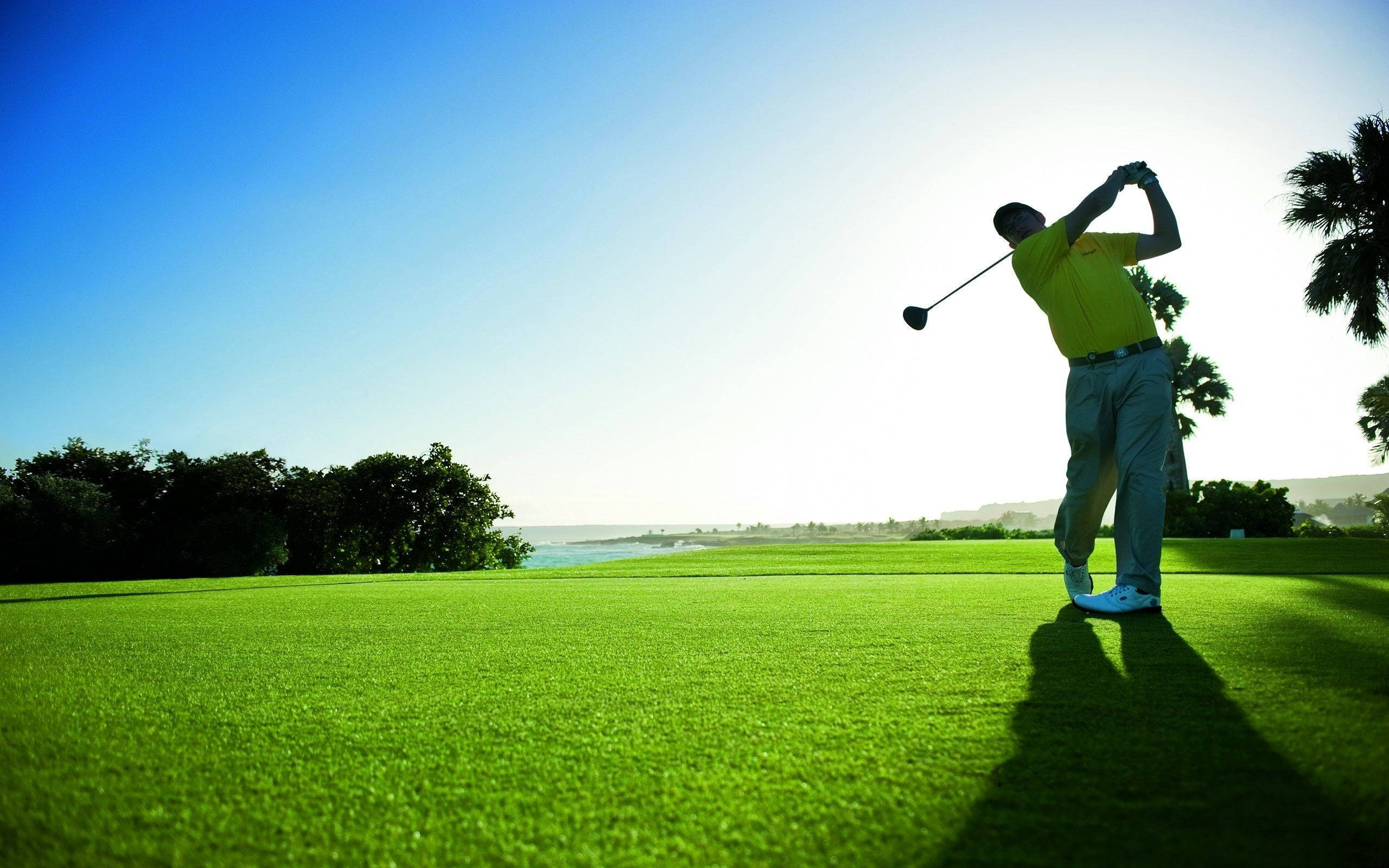 Cool Golf, bright yellow shirt, lush green course, 2K Desktop Wallpaper