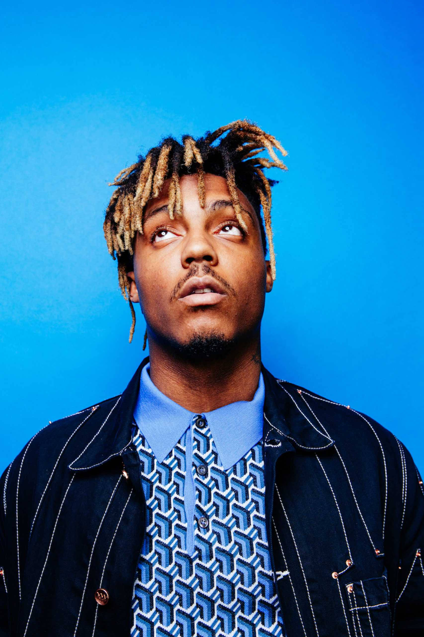 Cool Juice WRLD, braided hair, solid blue studio backdrop, 2K Phone Wallpaper