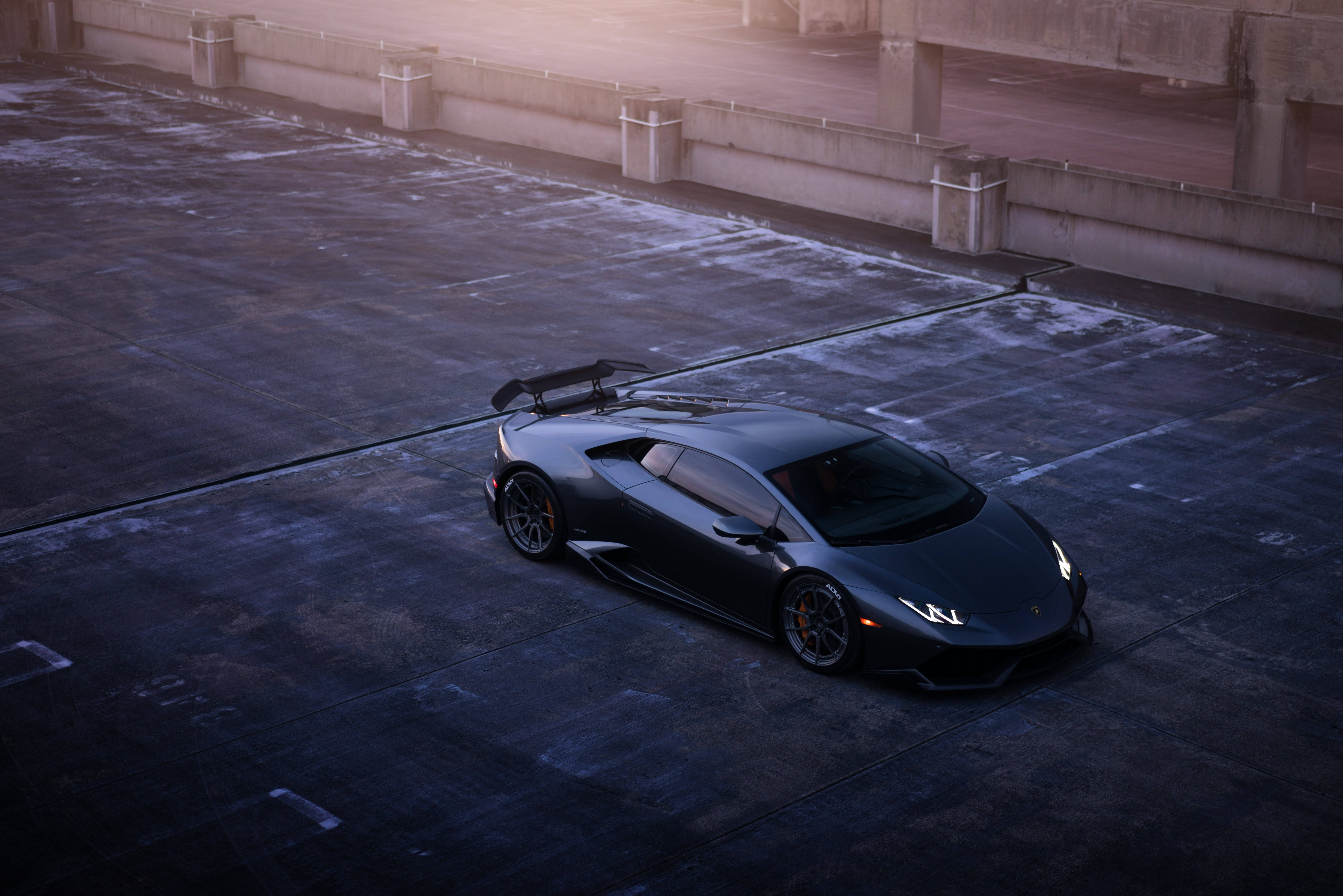 Lamborghini, sleek black, golden sunset light, 5K Desktop Wallpaper