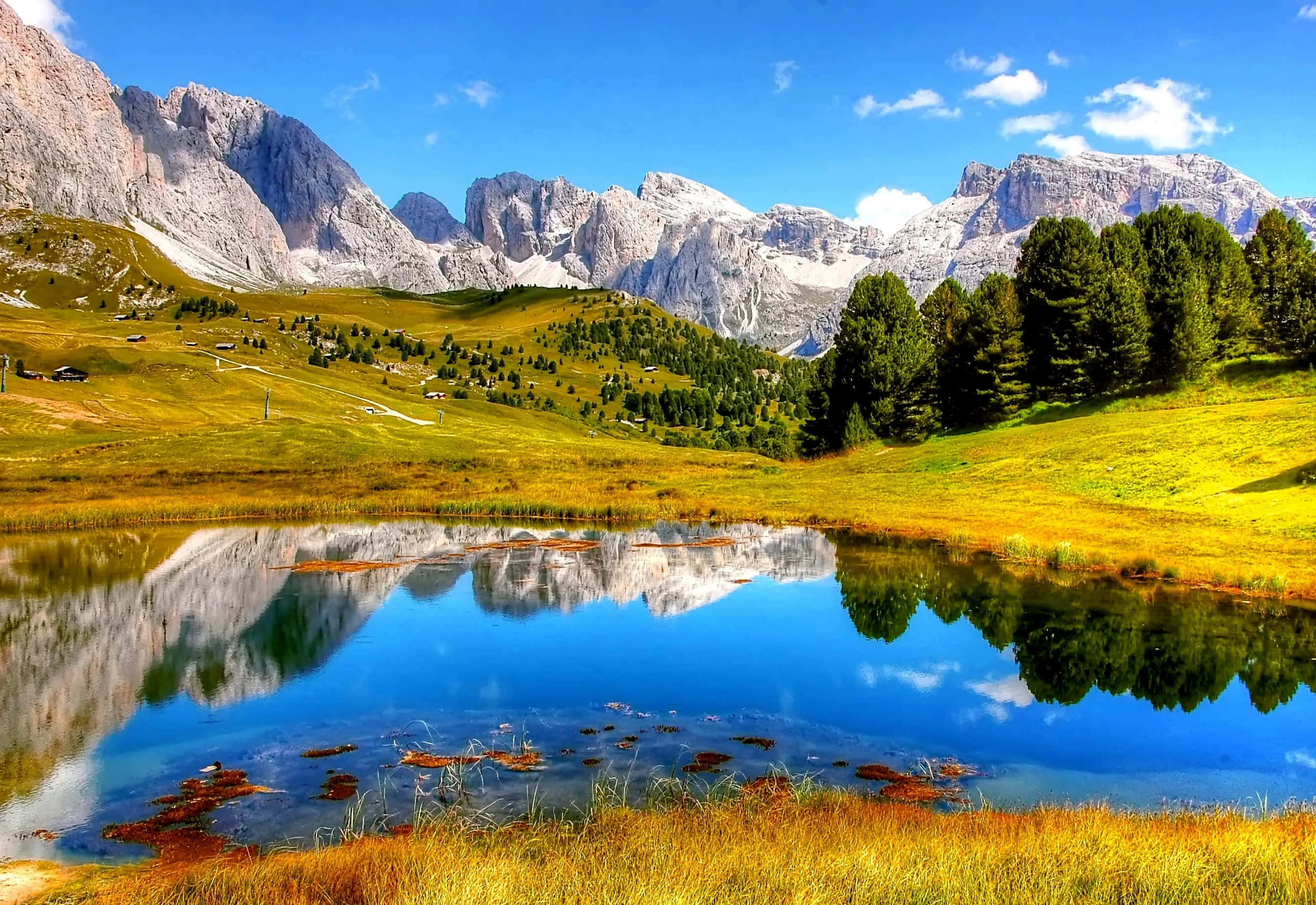alpine lake, snow-capped mountains, lush green hills, 2K Desktop Wallpaper