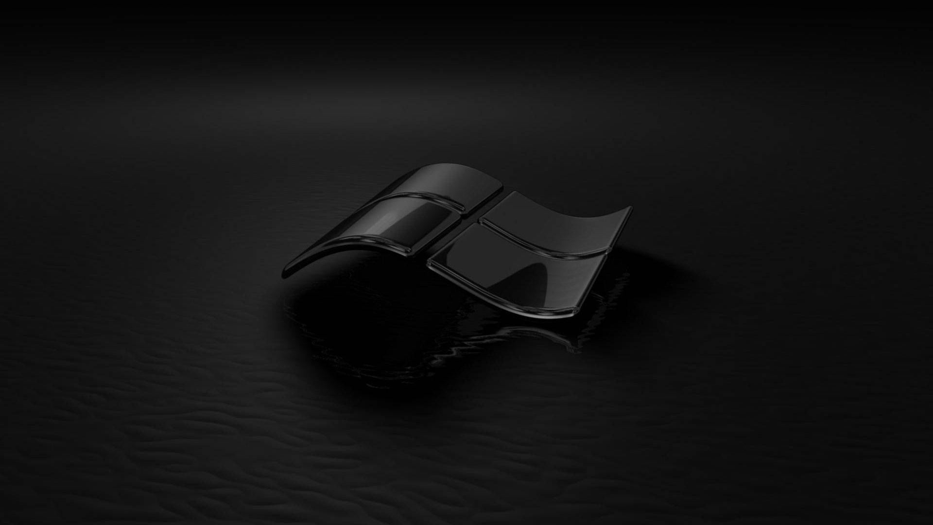 glossy black Windows logo, textured dark surface, dramatic spotlighting, Full HD Desktop Wallpaper