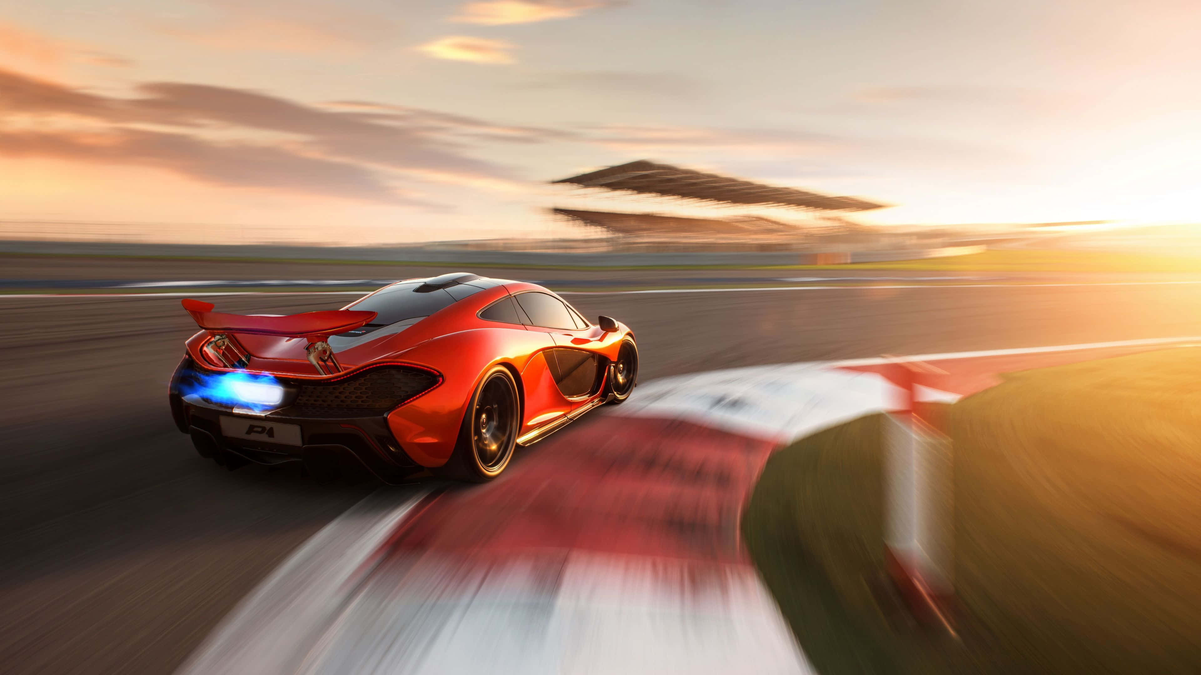 McLaren, vibrant red, racetrack, 4K Desktop Wallpaper