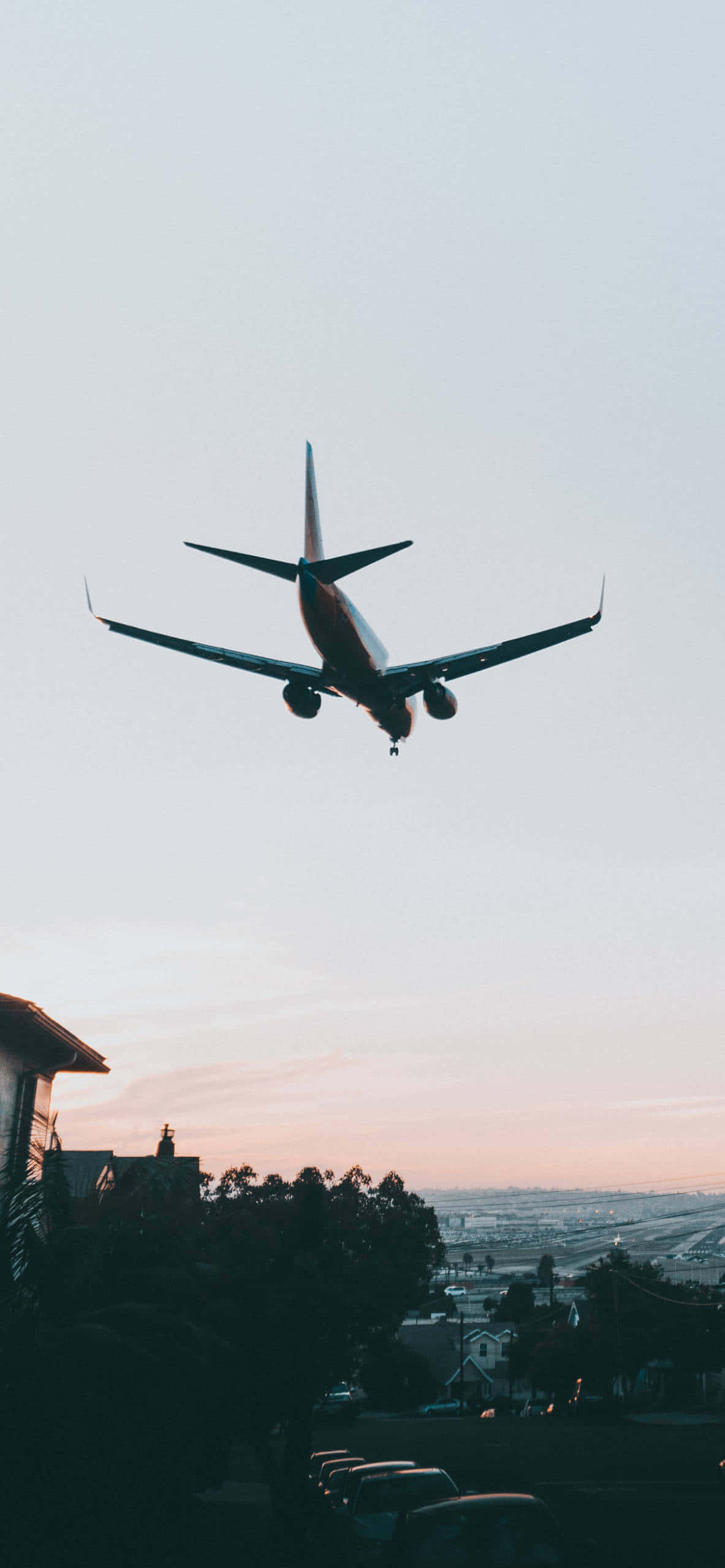 cool plane, pink and blue twilight sky, suburban neighborhood, 2K Phone Wallpaper