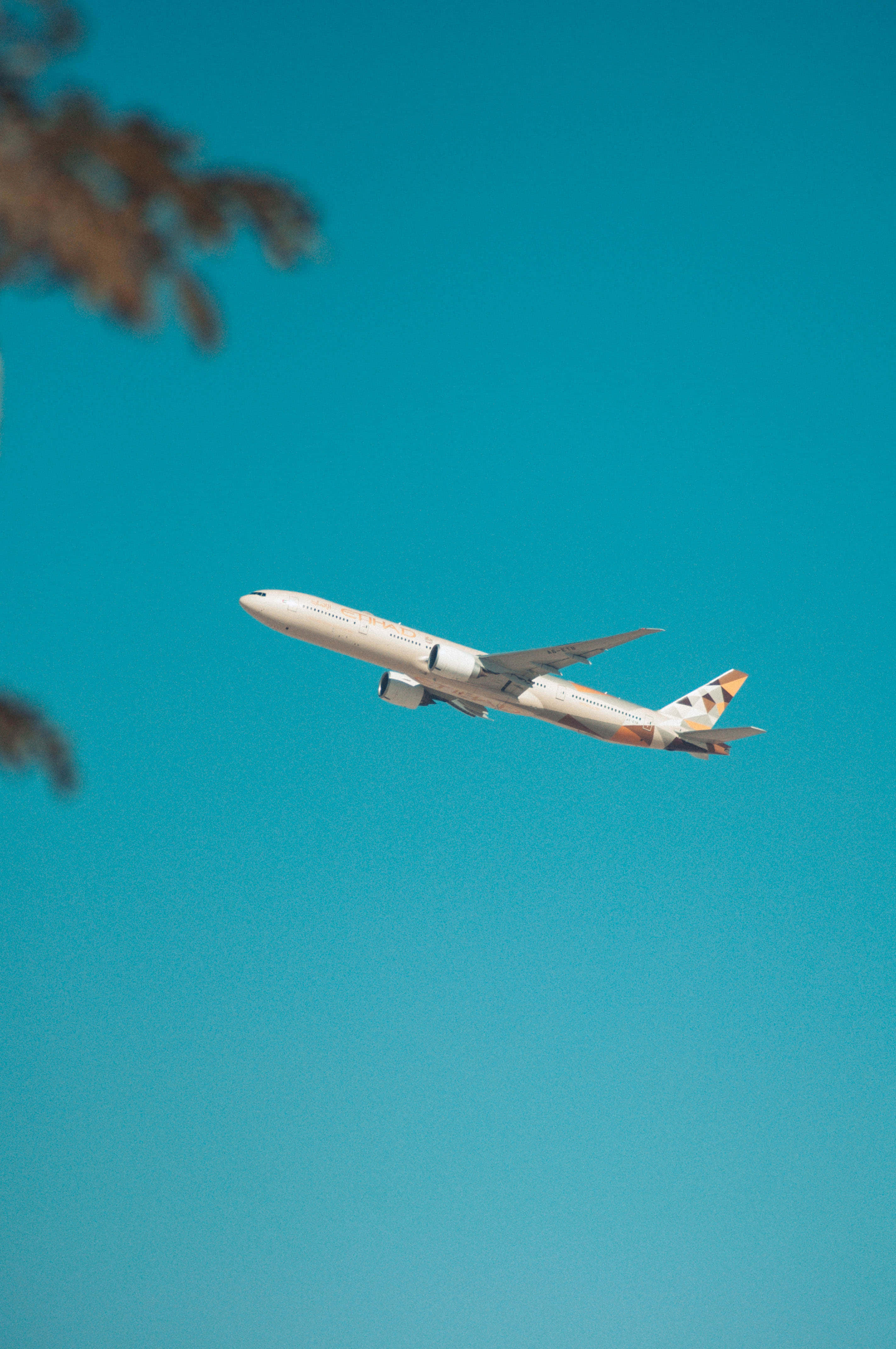 cool plane, sleek white airplane, vibrant turquoise sky, 4K Phone Wallpaper
