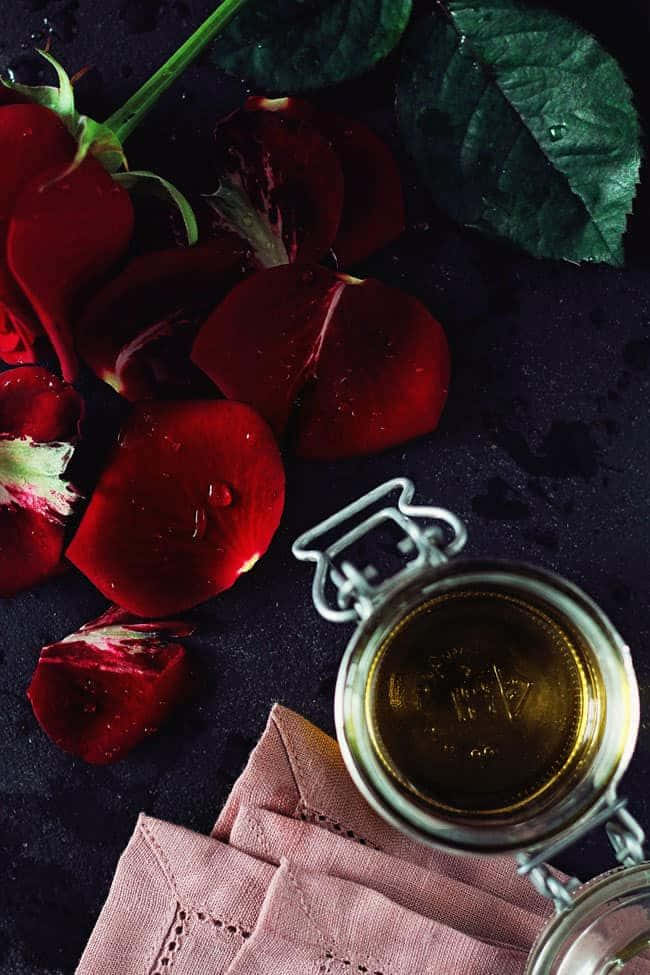 rose oil, golden liquid, dark textured surface, SD Phone Wallpaper