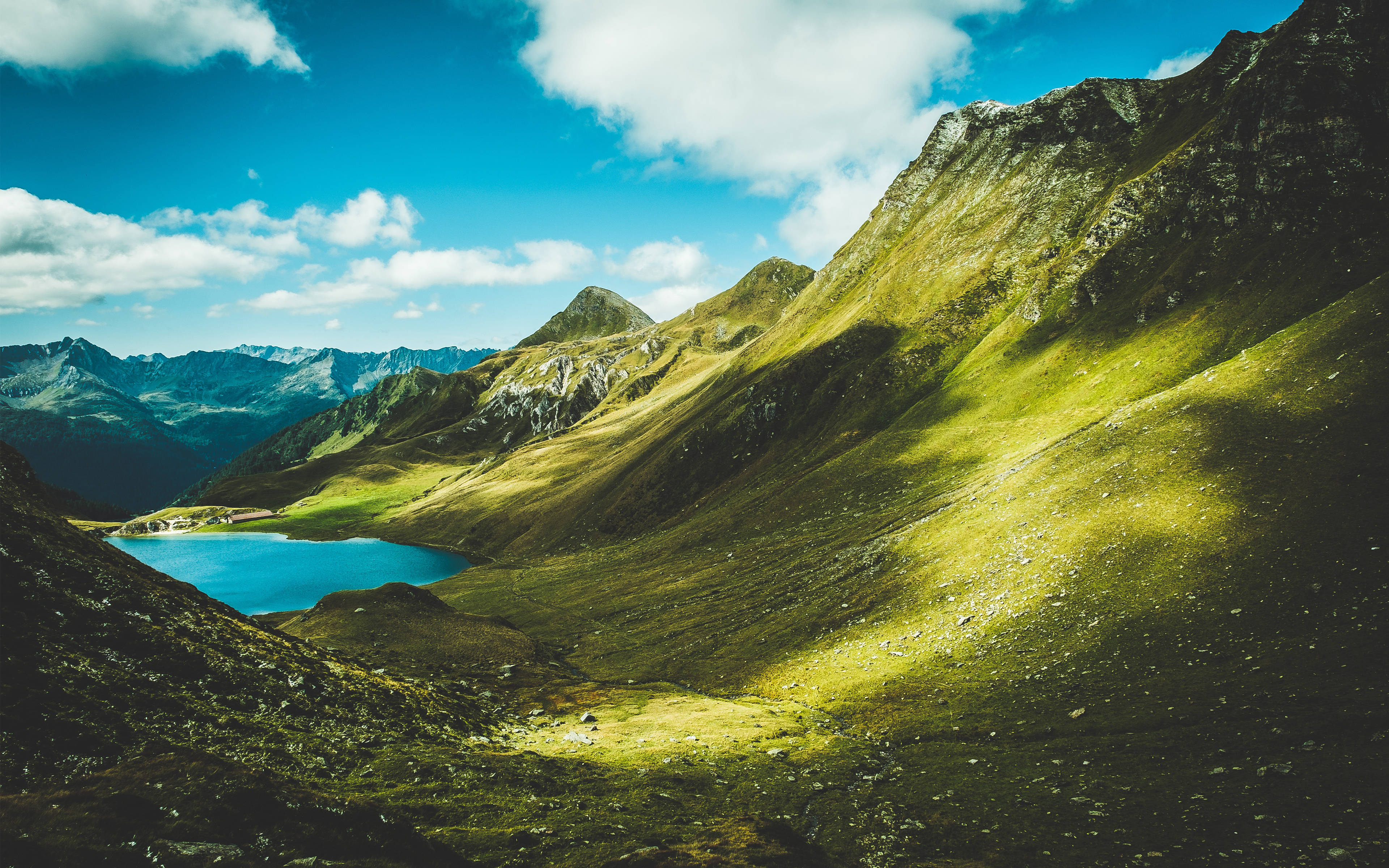 alpine lake, sunlit green mountains, bright blue sky, 4K Desktop Wallpaper