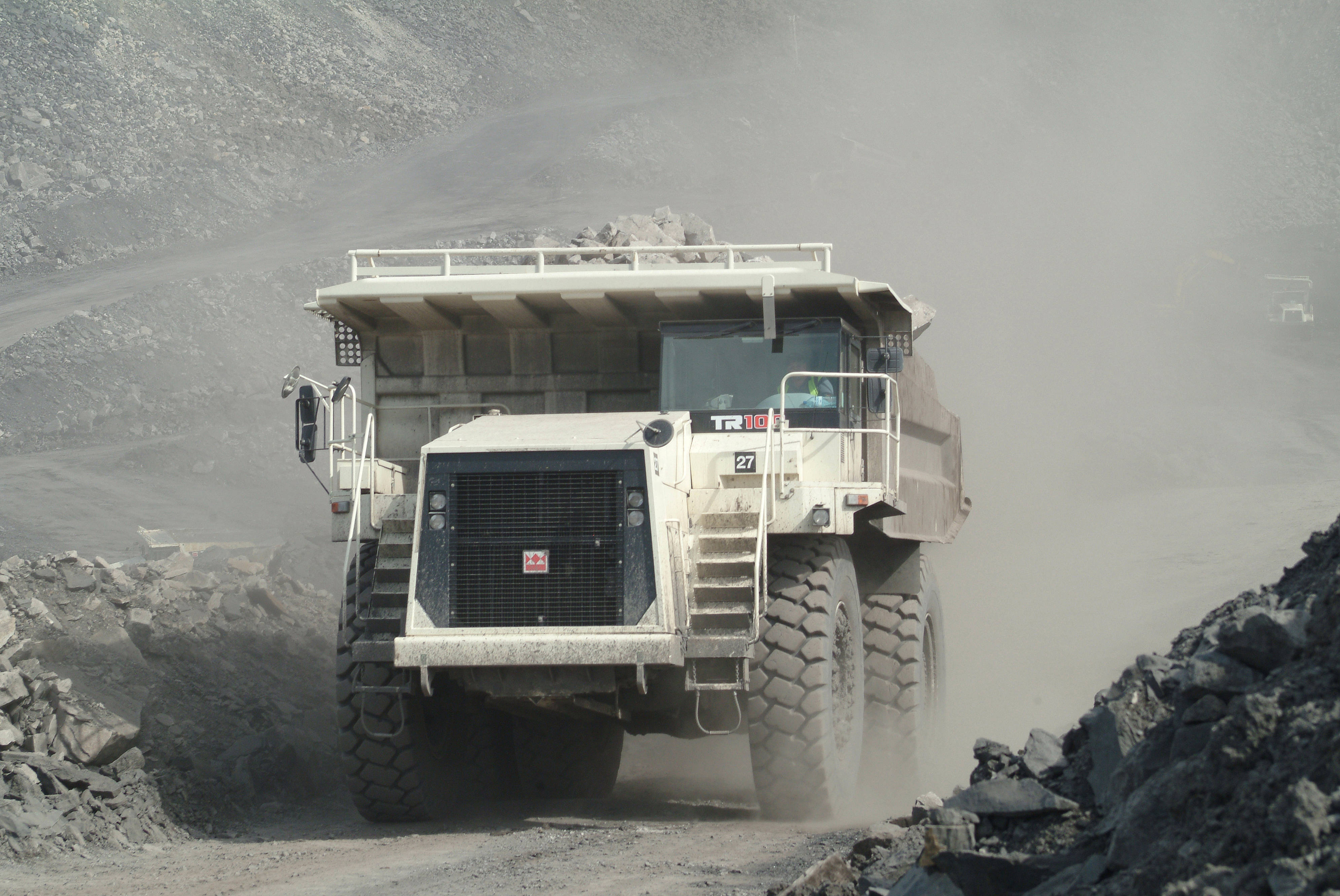 massive white mining dump truck, dusty road, rugged rocky quarry, 4K Desktop Wallpaper