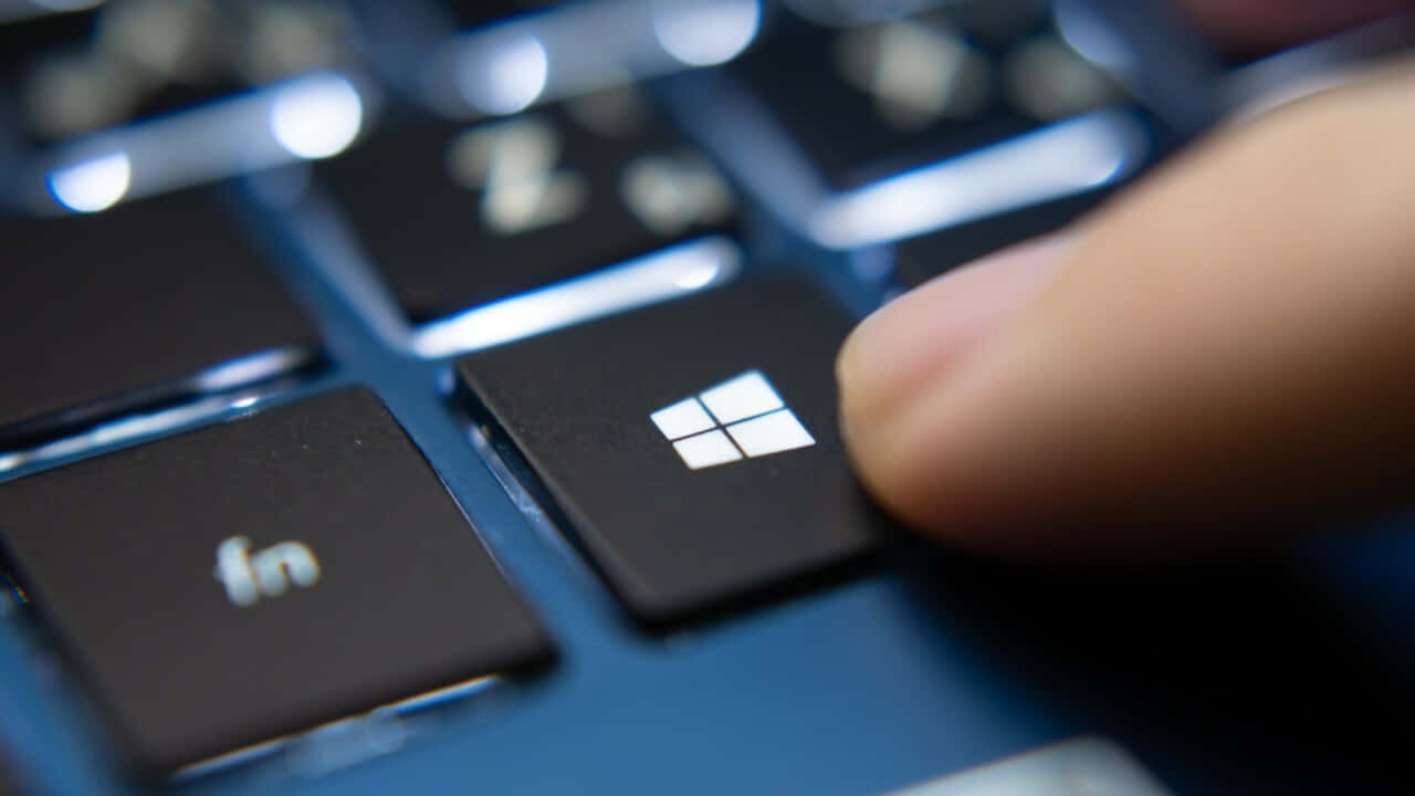 Windows key, sleek black keyboard, glowing reflections, HD Desktop Wallpaper