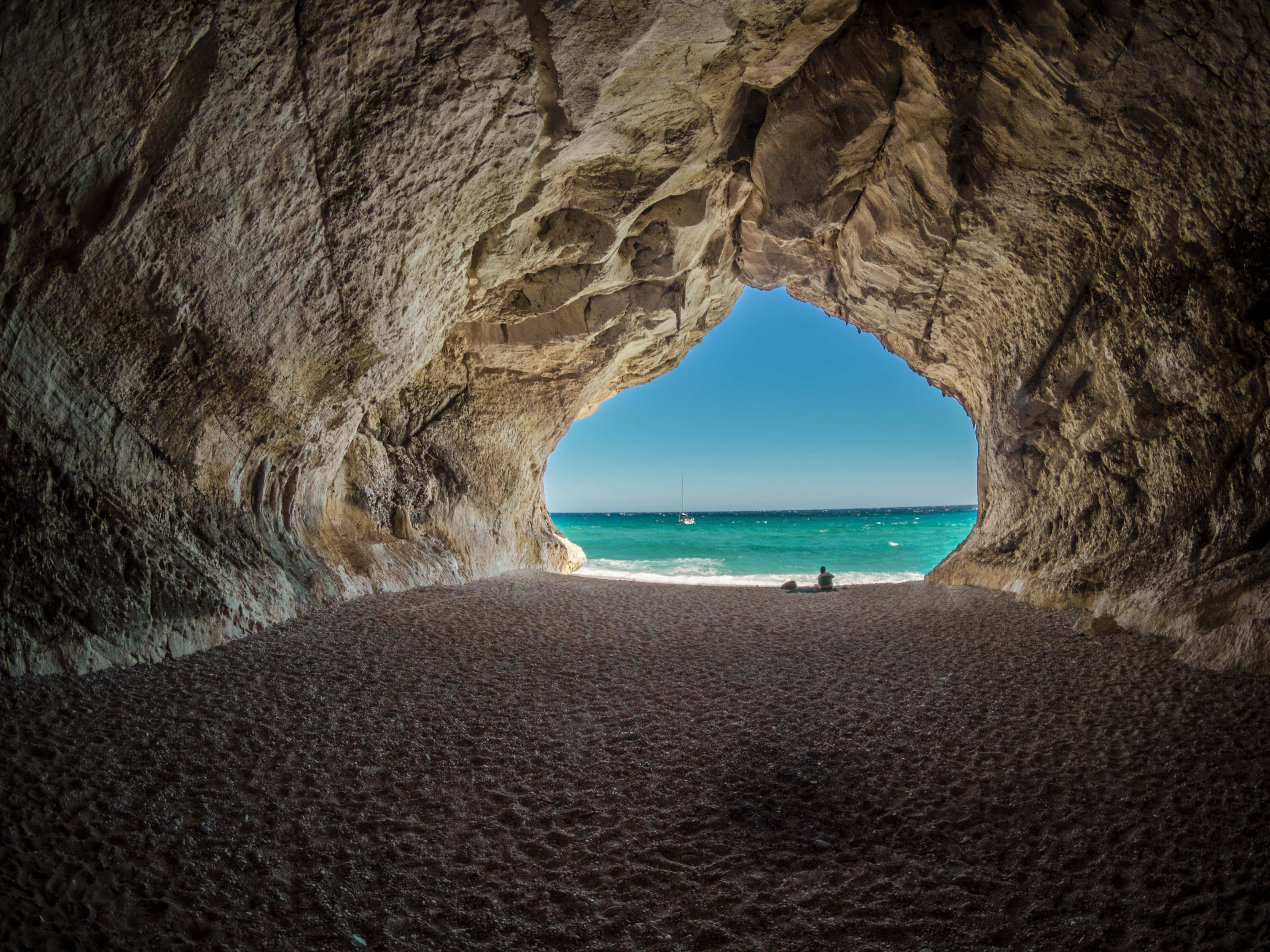 Windows desktop, dark sandy beach, massive natural rock cave, 4K Desktop Wallpaper