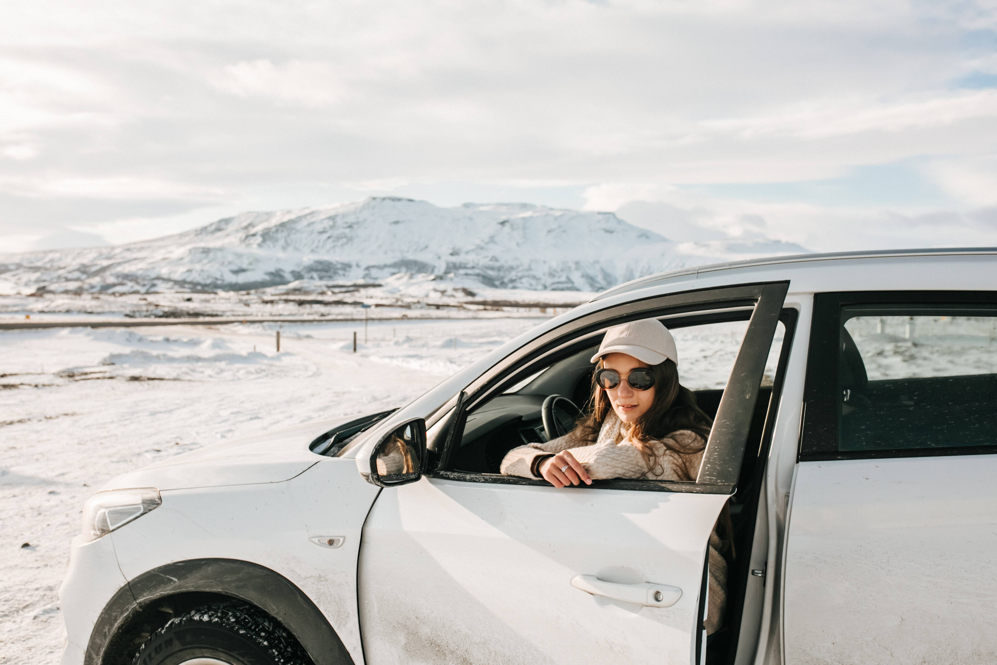 woman, white car, snowy mountain backdrop, 4K Desktop Wallpaper