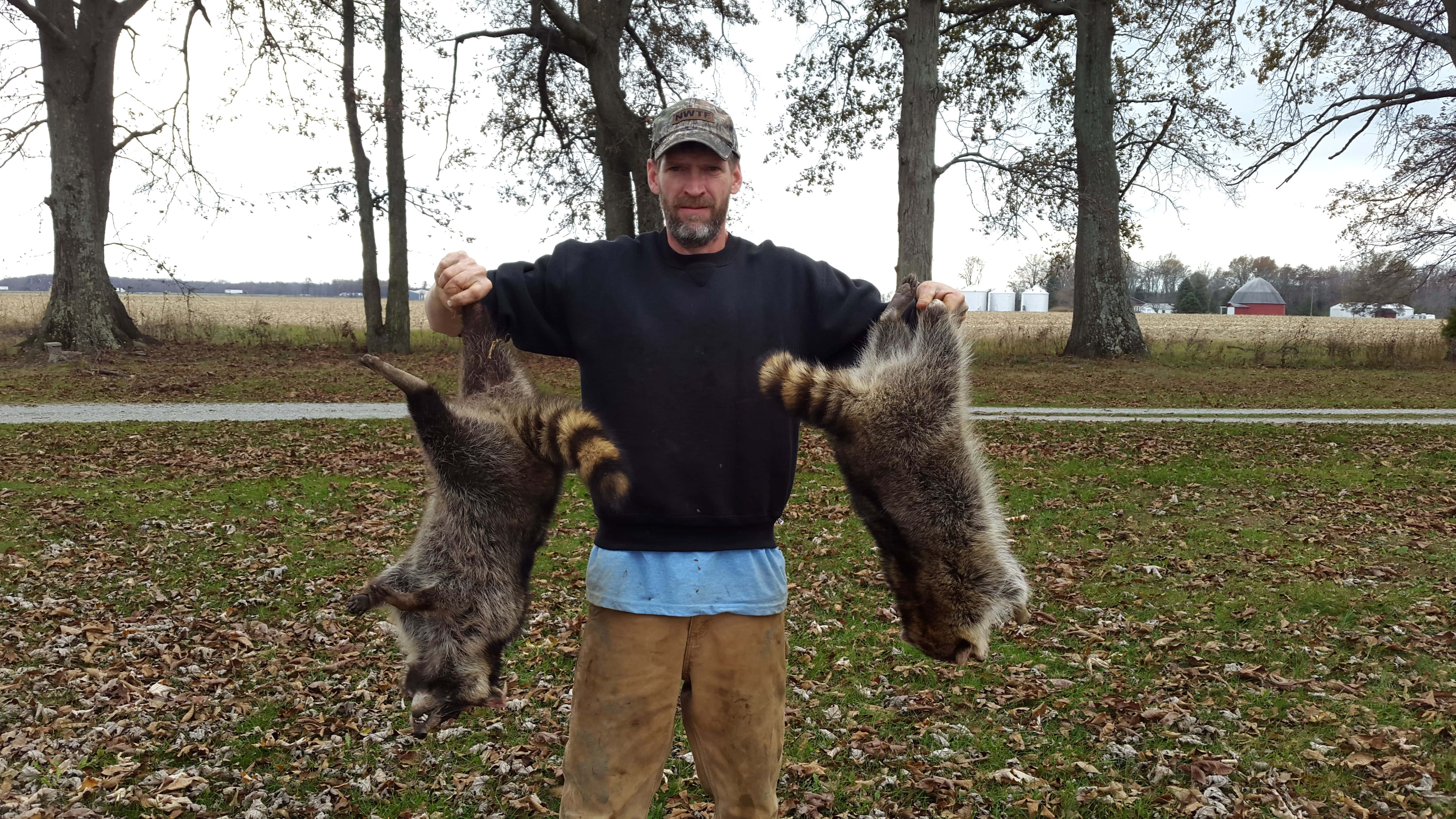 hunter, raccoon pelts, grassy field, 4K Desktop Wallpaper