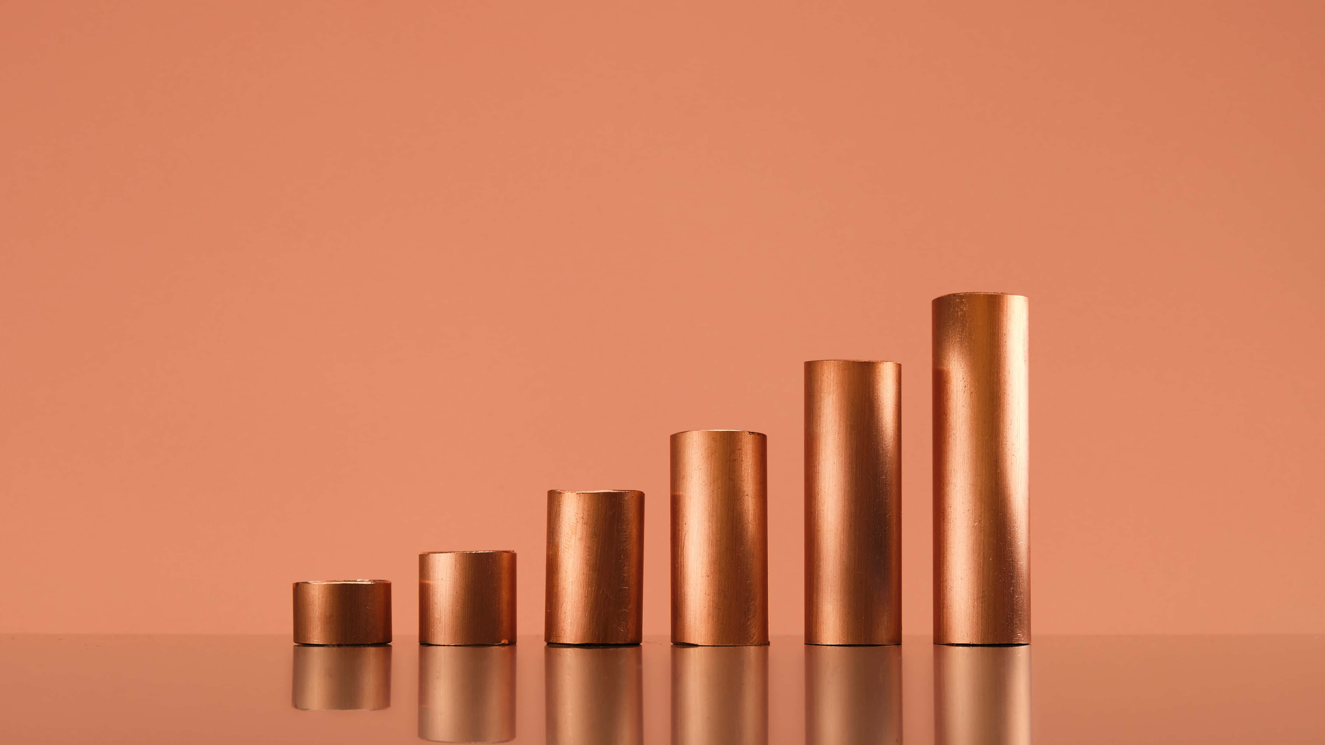 copper cylinders, gradient display, warm terracotta background, 4K Desktop Wallpaper