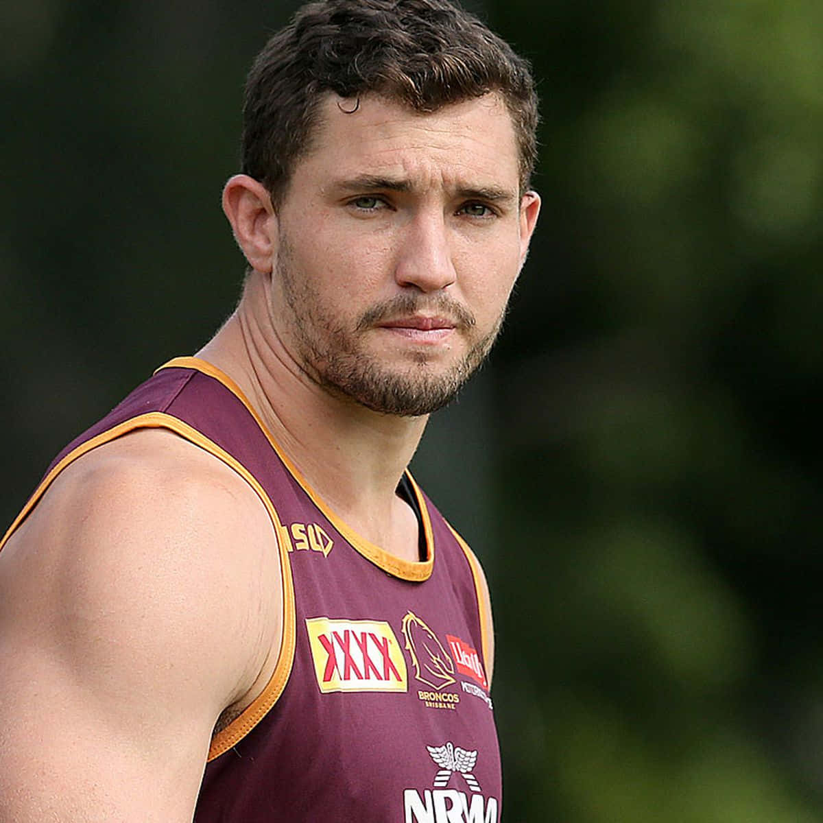 Corey Oates, maroon and gold sports jersey, blurred green background, SD Desktop Wallpaper