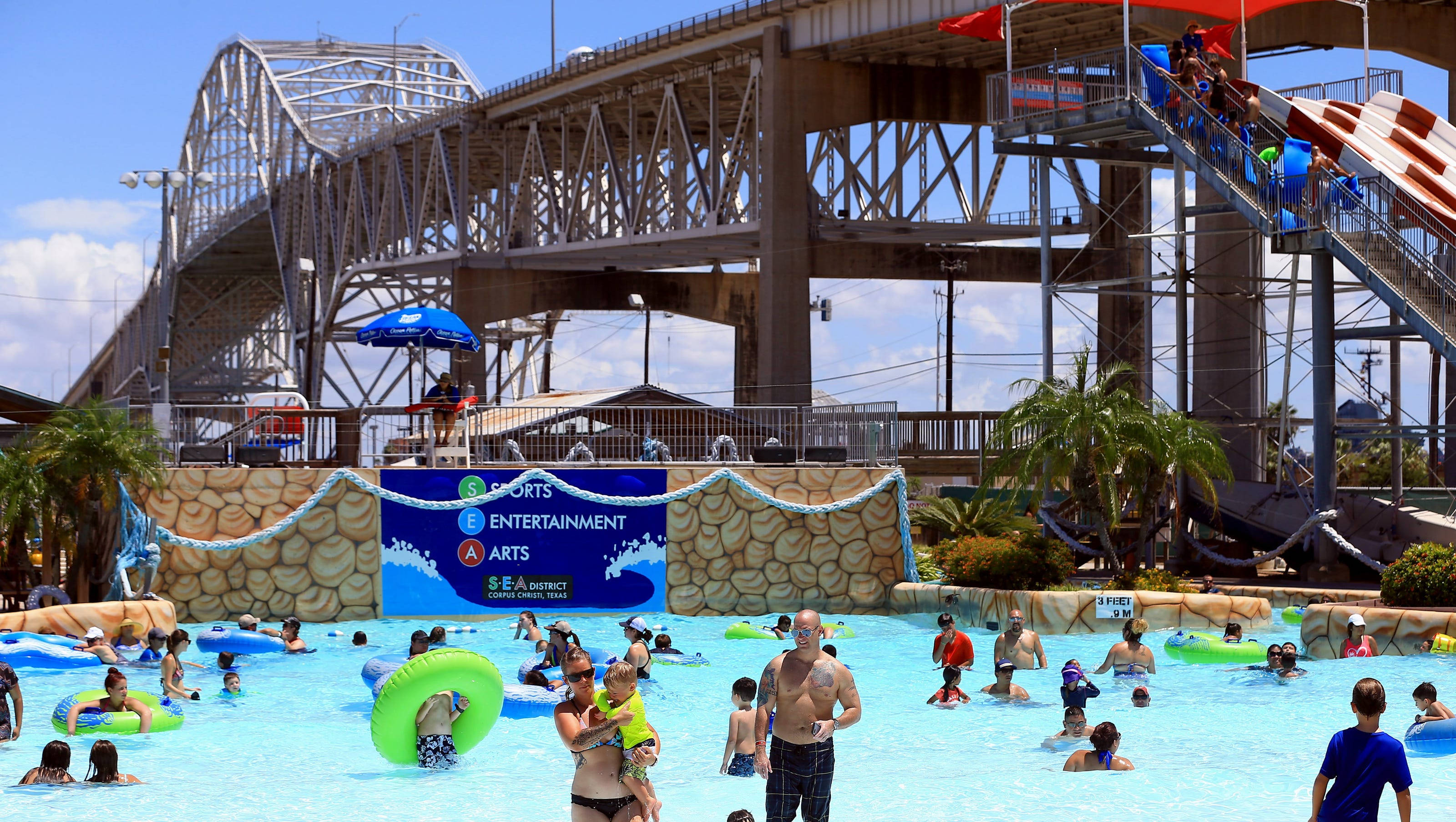Corpus Christi Water Park, lively water park, large metal bridge, 2K Desktop Wallpaper