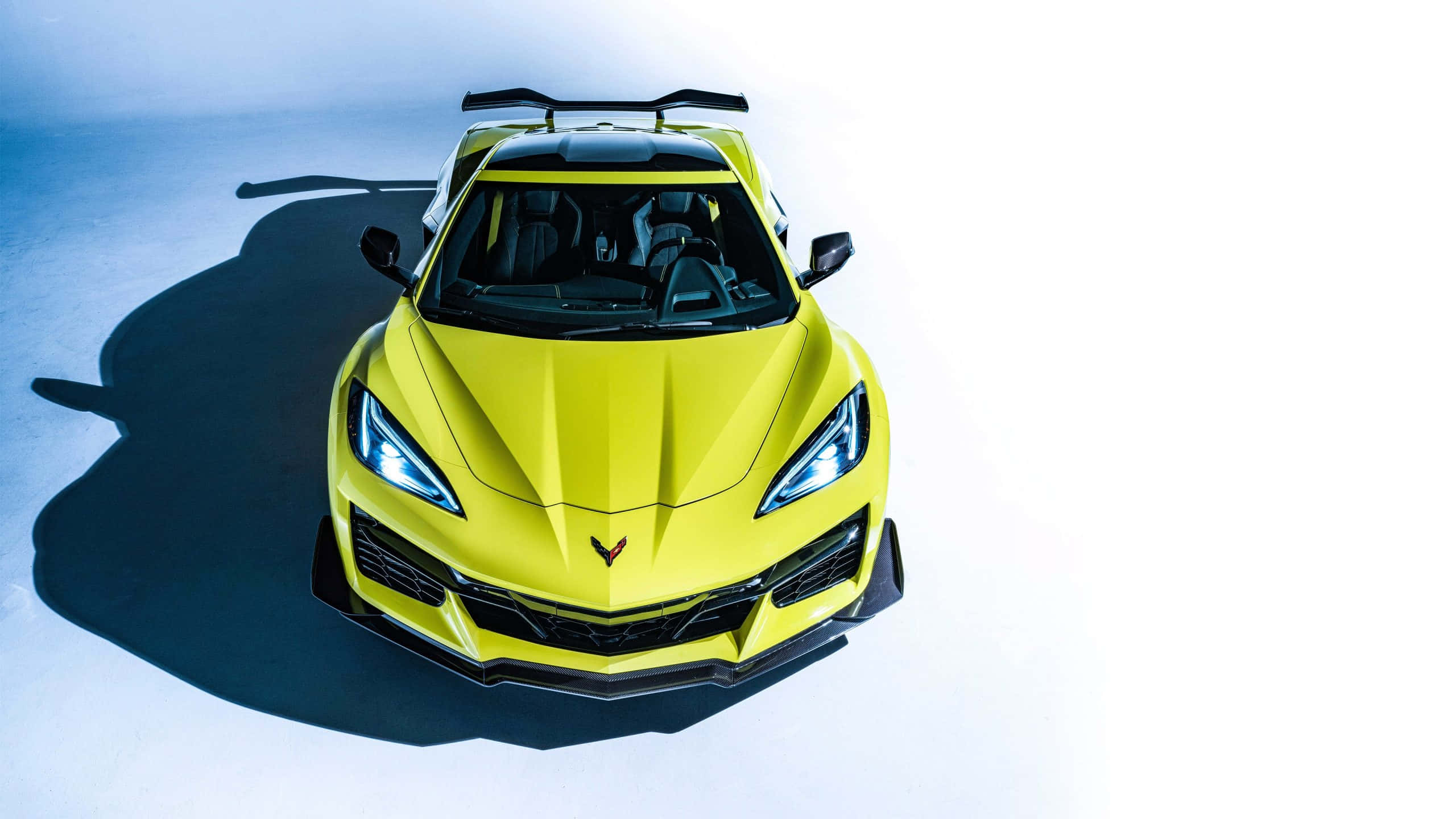 Yellow Corvette C8, top view, vibrant yellow, 2K Desktop Wallpaper