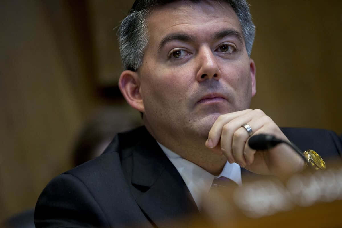 Cory Gardner, dark suit, wooden table, SD Desktop Wallpaper