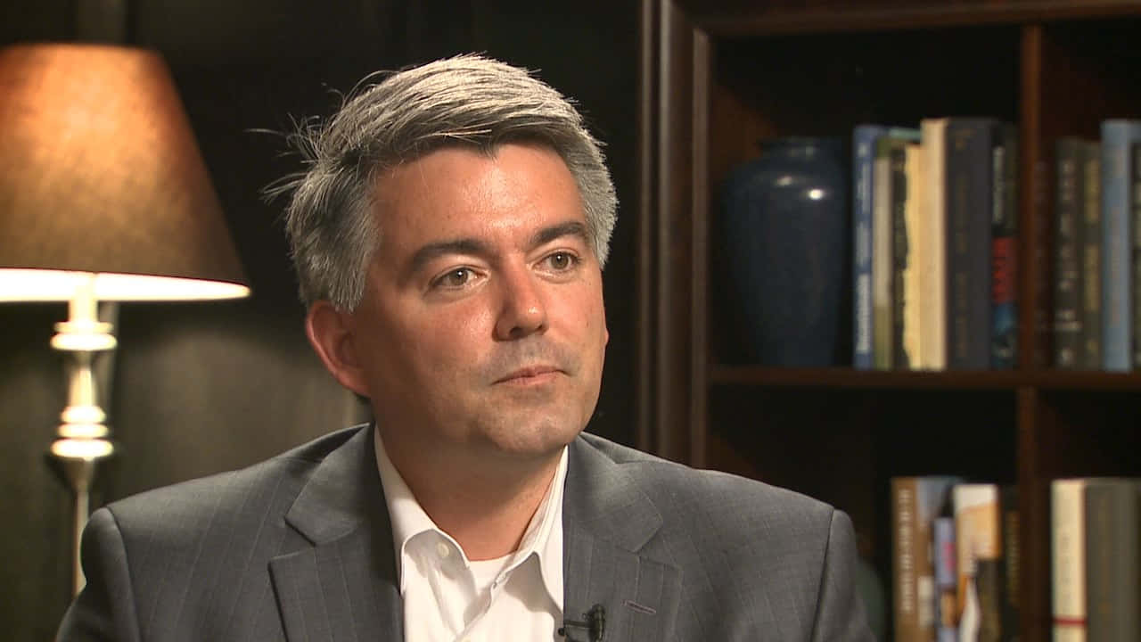 Cory Gardner, gray suit, warmly lit study, HD Desktop Wallpaper