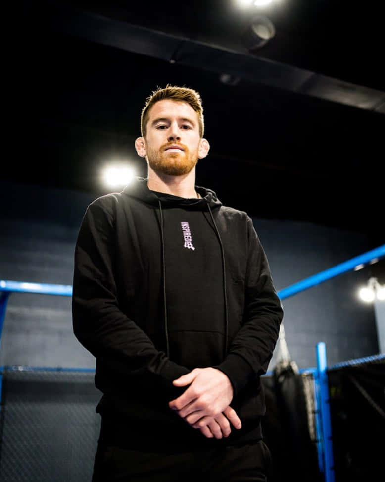 Cory Sandhagen, black hoodie, dimly lit gym, SD Phone Wallpaper